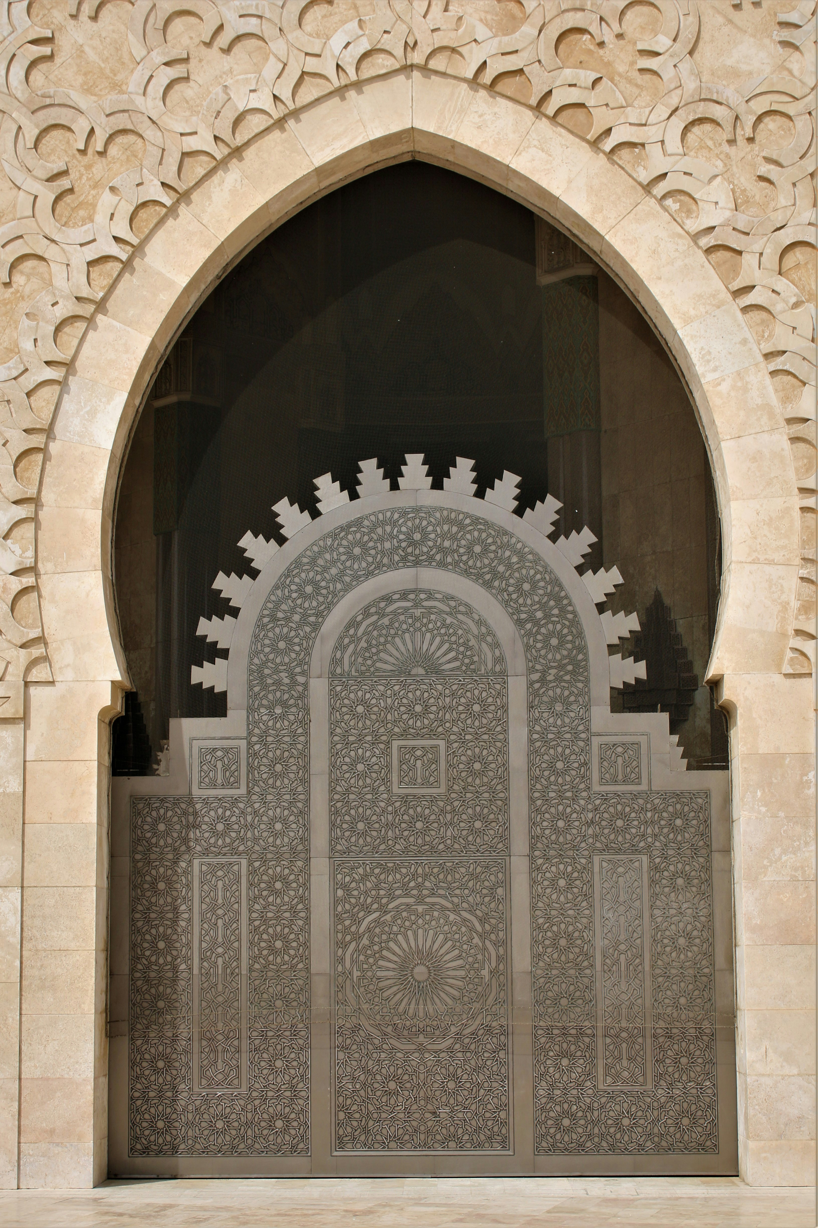 a door with a decorative design on the side of a building