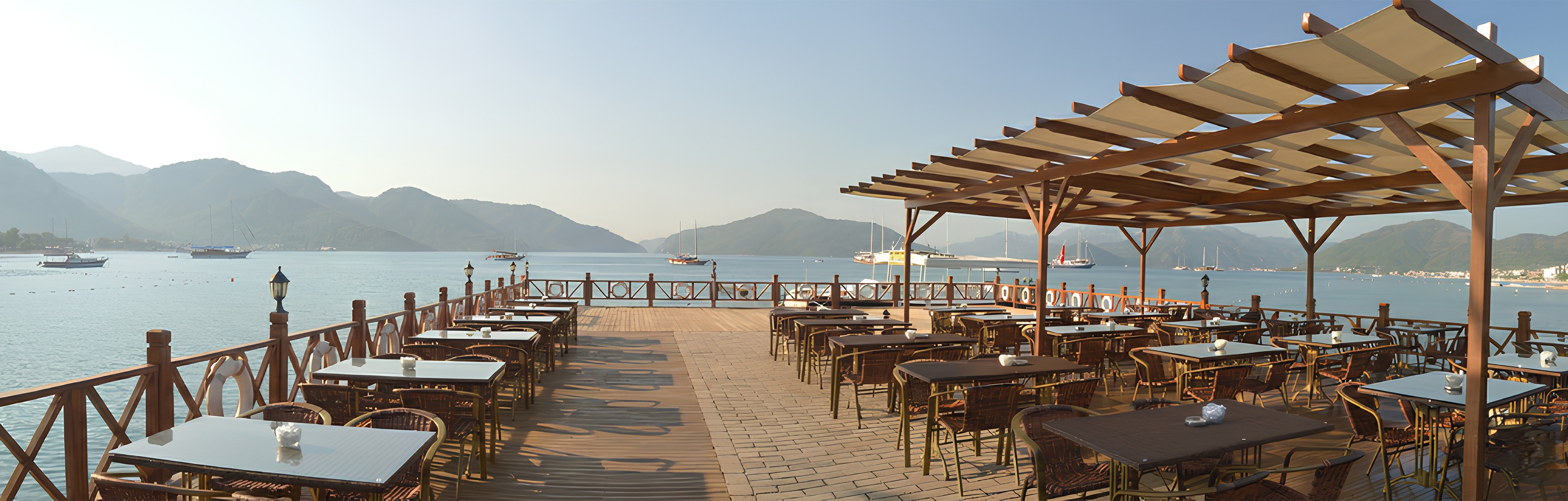 woman holding a phone and man looking at the phone. both are smiling