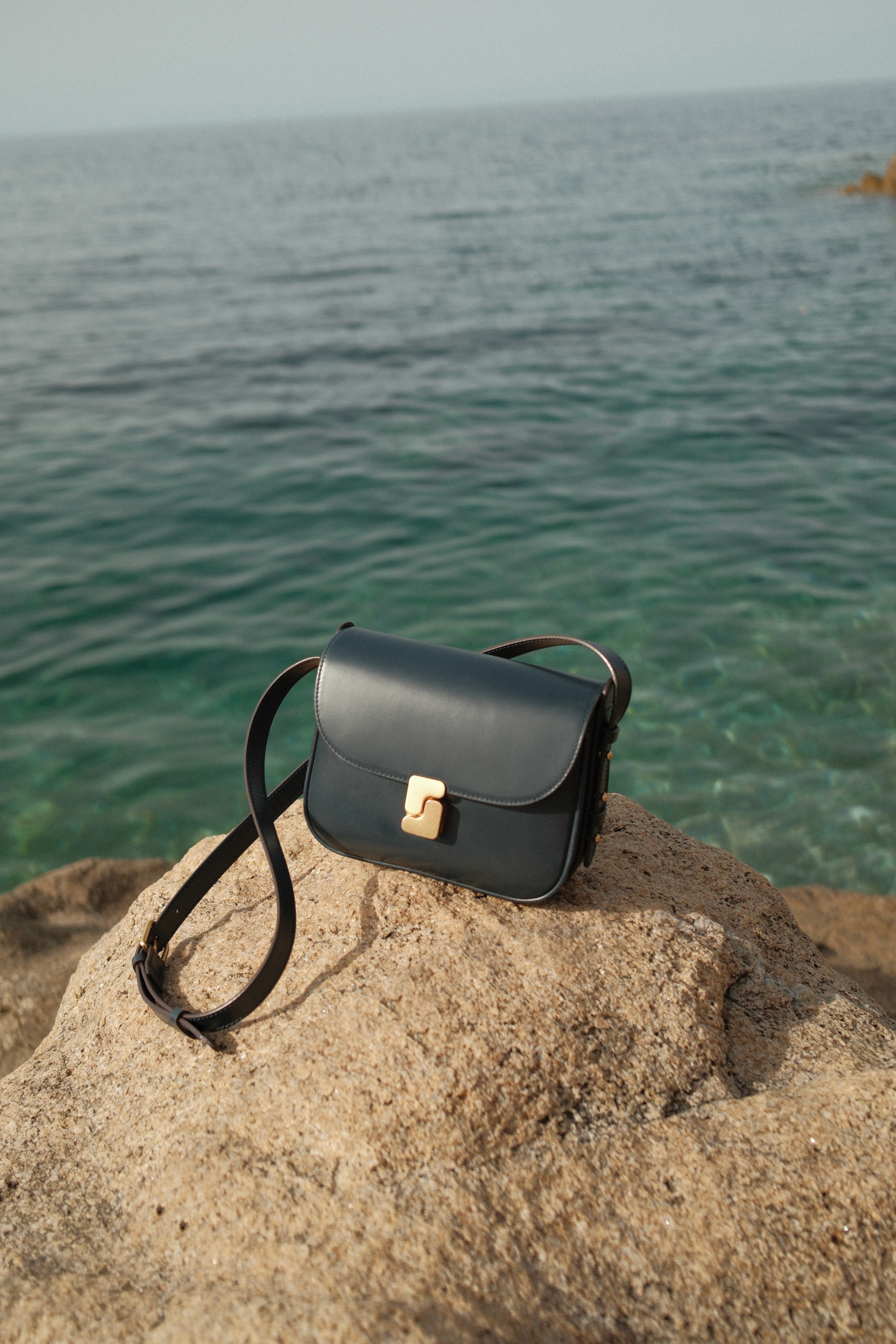 Young woman looking out a window at night