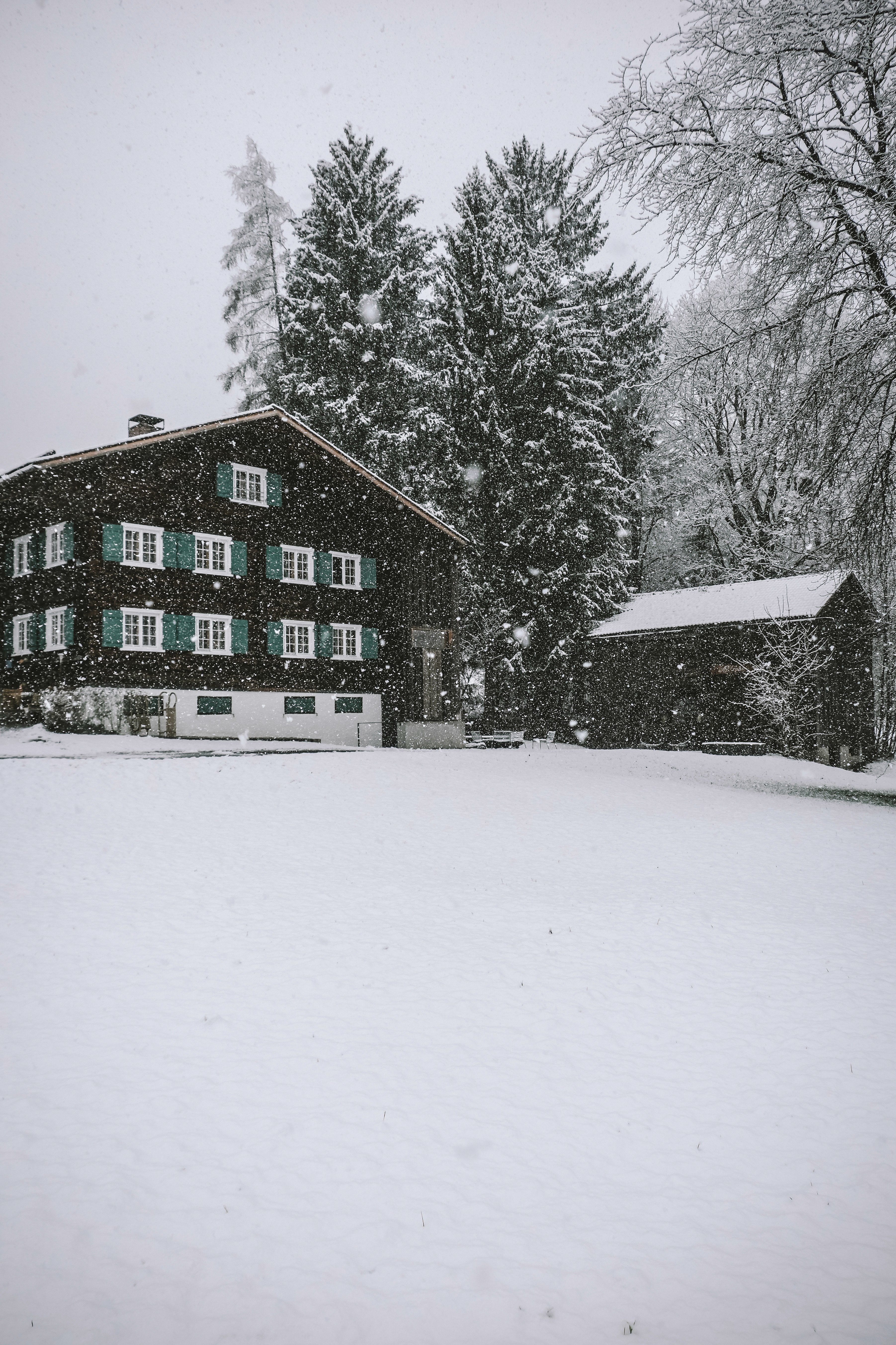 The wooden ski lodge Benedikta in Vandans in the snowfall.