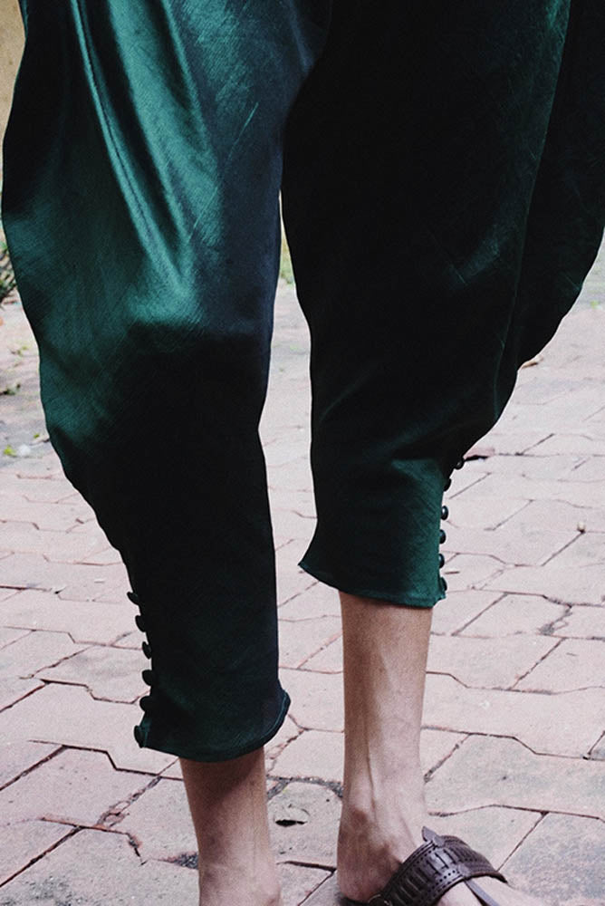 Paunji reimagined dhoti pants with tapered hem and fabric button ankle detail.