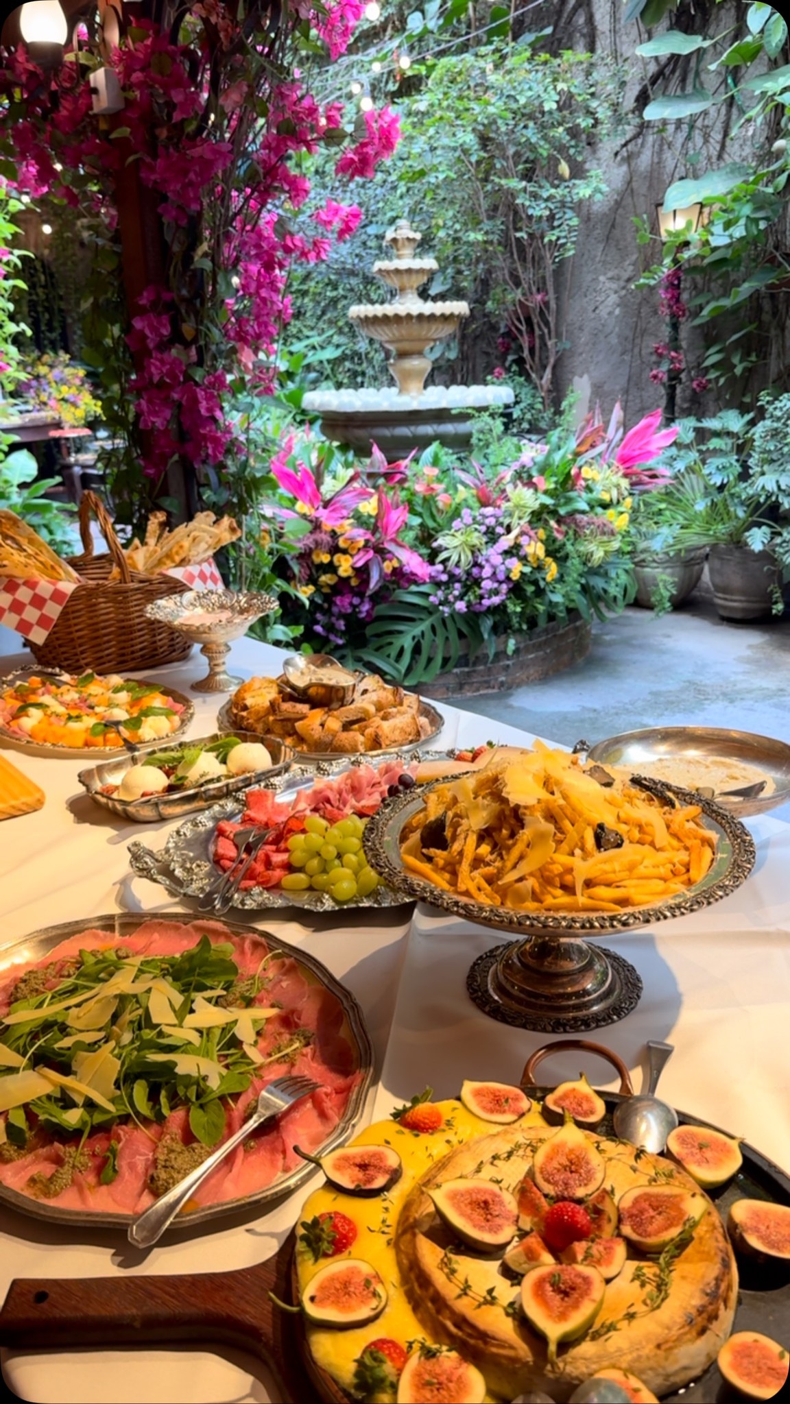 A serene pathway lined with trees leads to a distant building, bathed in warm sunlight.
