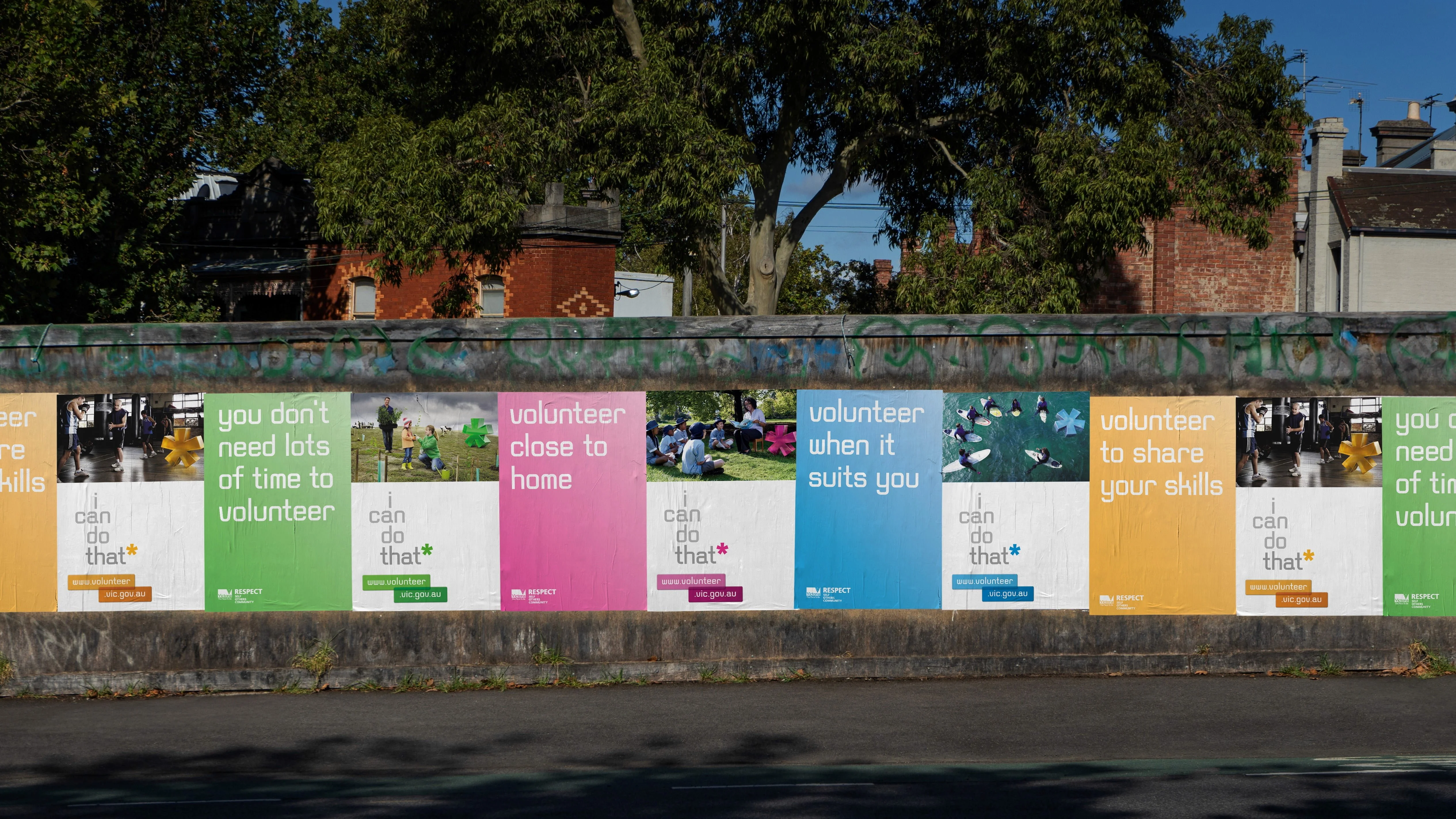 Row of 'I can do that' volunteering posters on a wall, including 'volunteer close to home' and 'volunteer when it suits you'
