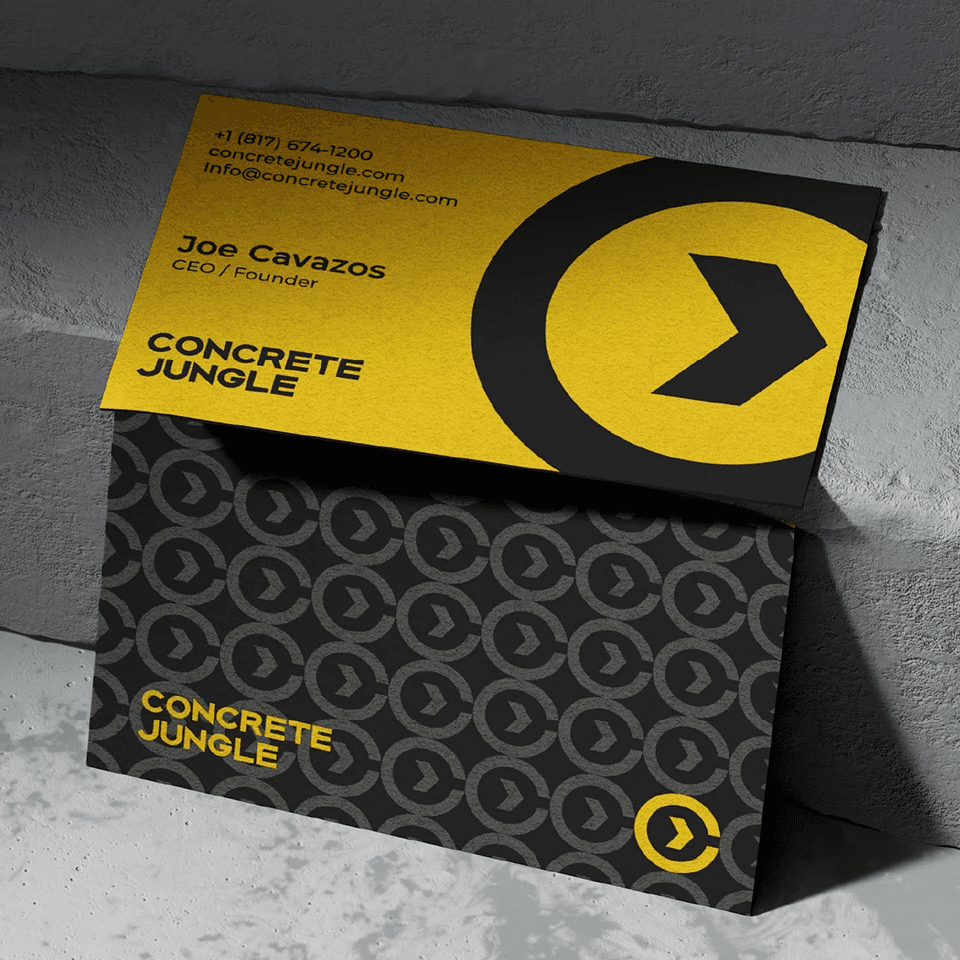Concrete Jungle brand identity applied to yellow and black business cards.