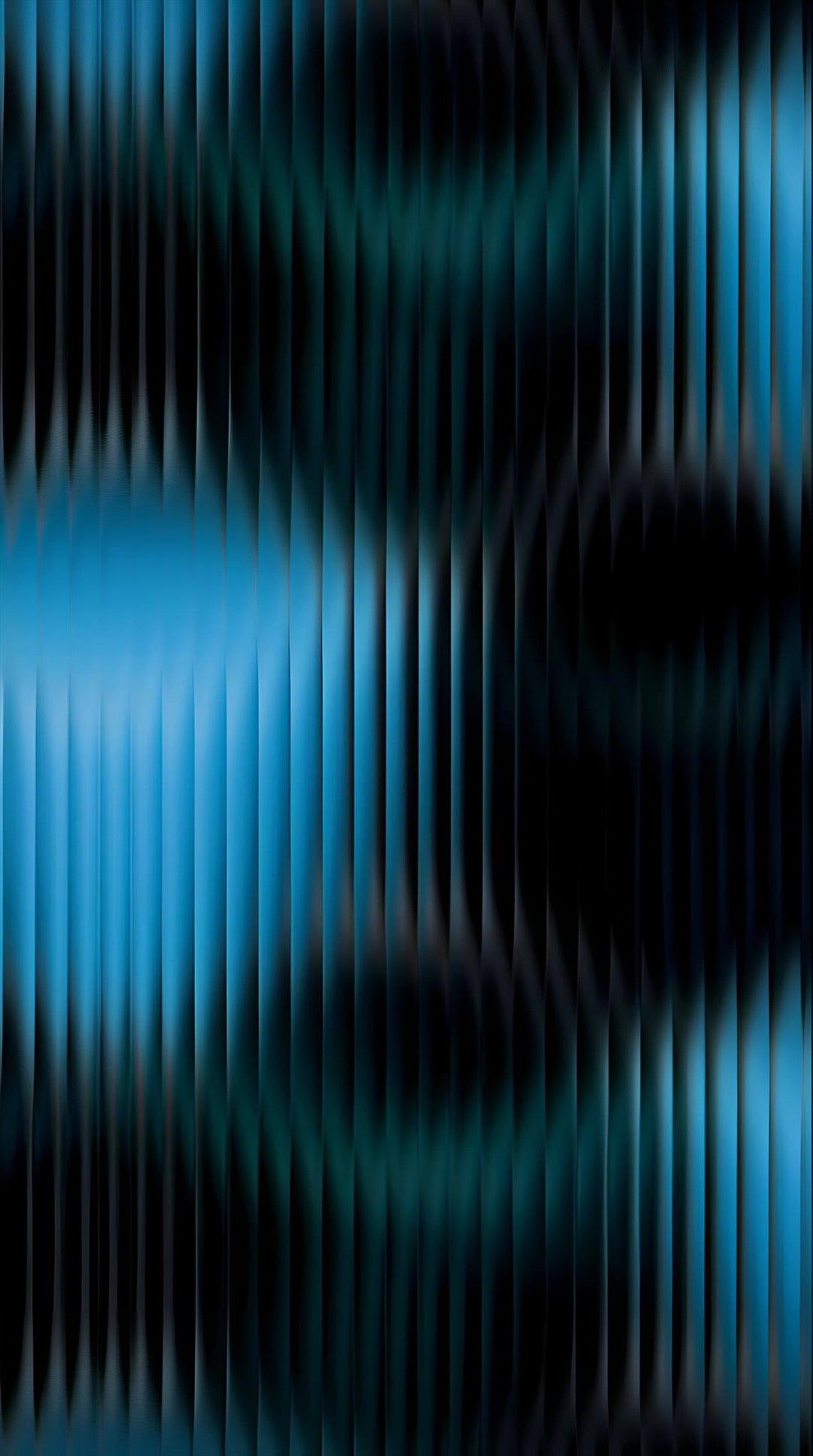 Layered blue mountains fade into a soft pink sky.