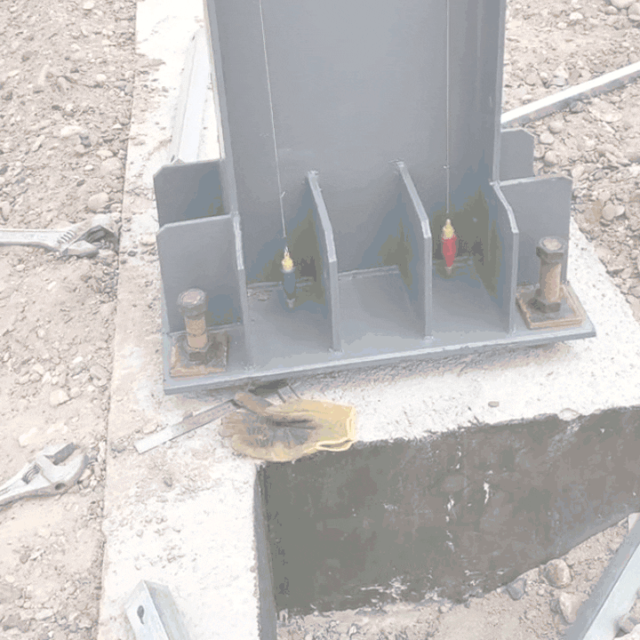 Steel column base plate installed on site during erection