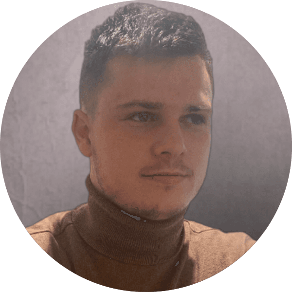 Illustrated avatar of a smiling man with short brown hair, wearing a white shirt and tie, on a blue background.