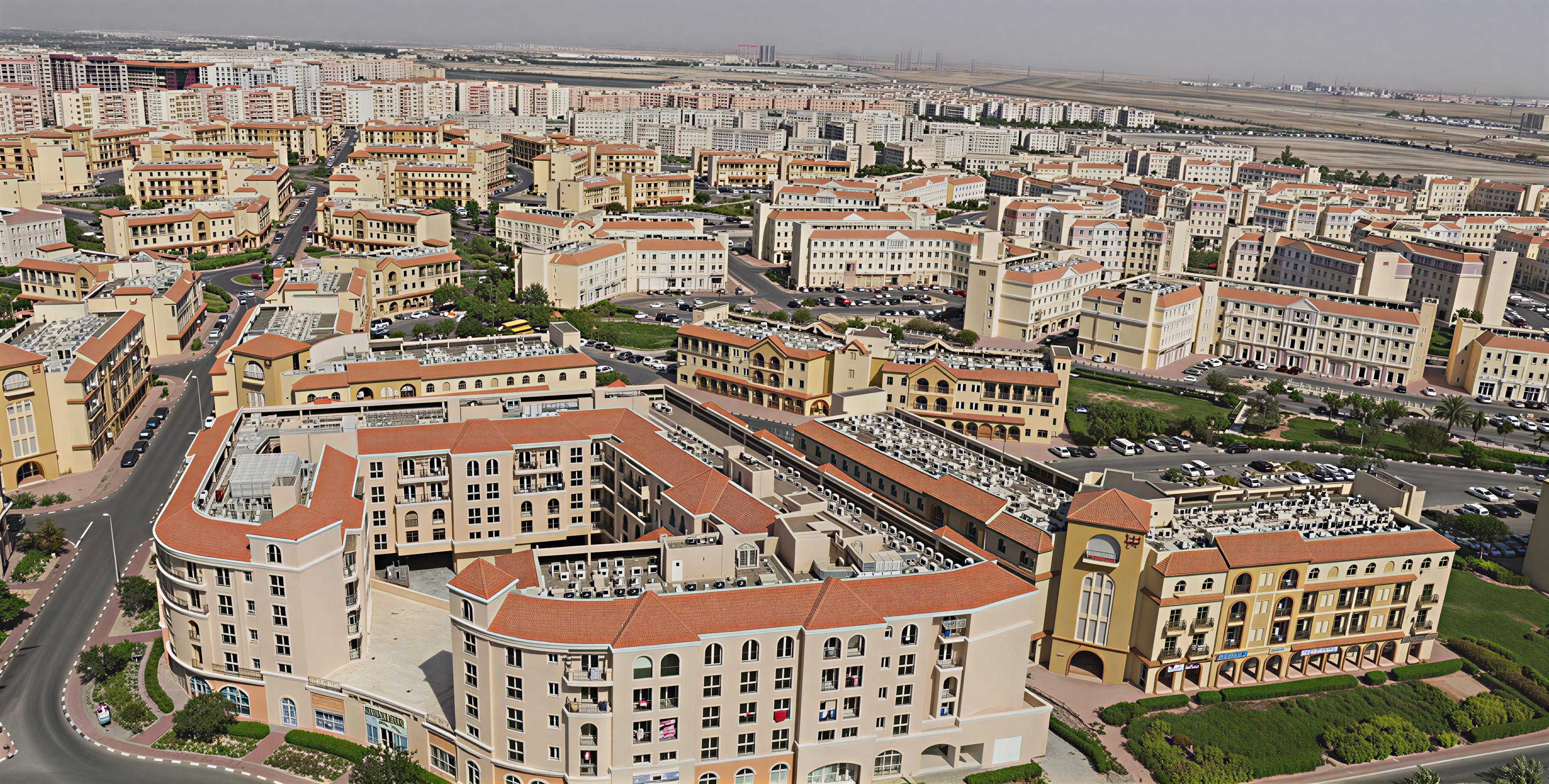 The apartment building in International City, characterized by its unique architecture and vibrant surroundings.