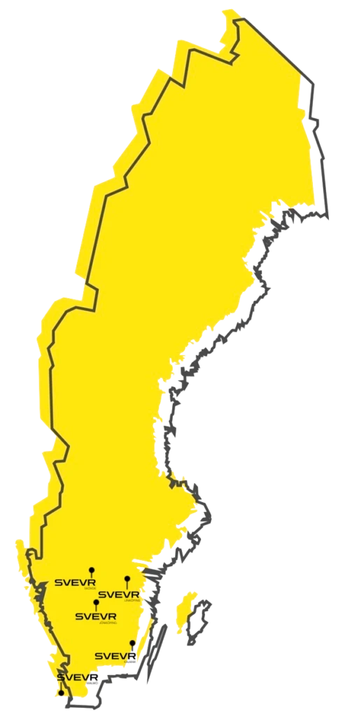 Close-up of a dark green leaf showing its textured surface and central vein against a muted background.