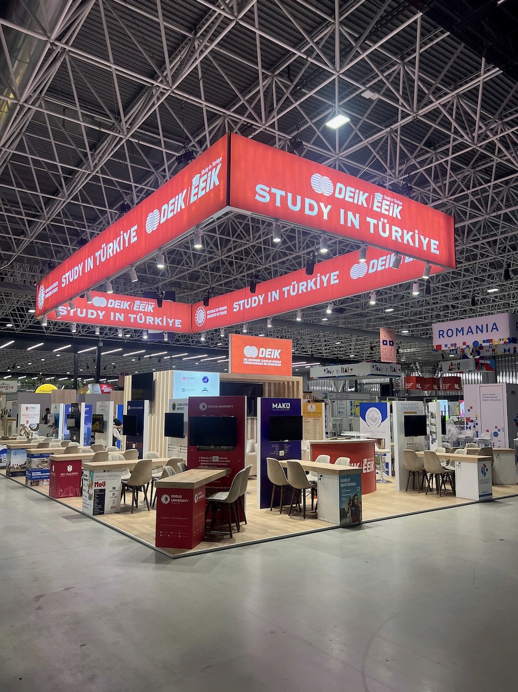 DEİK Study in Türkiye country pavilion at EAIE Toulouse 2024, featuring a large logo wall with 'DEIK' and 'STUDY IN TÜRKIYE' branding.