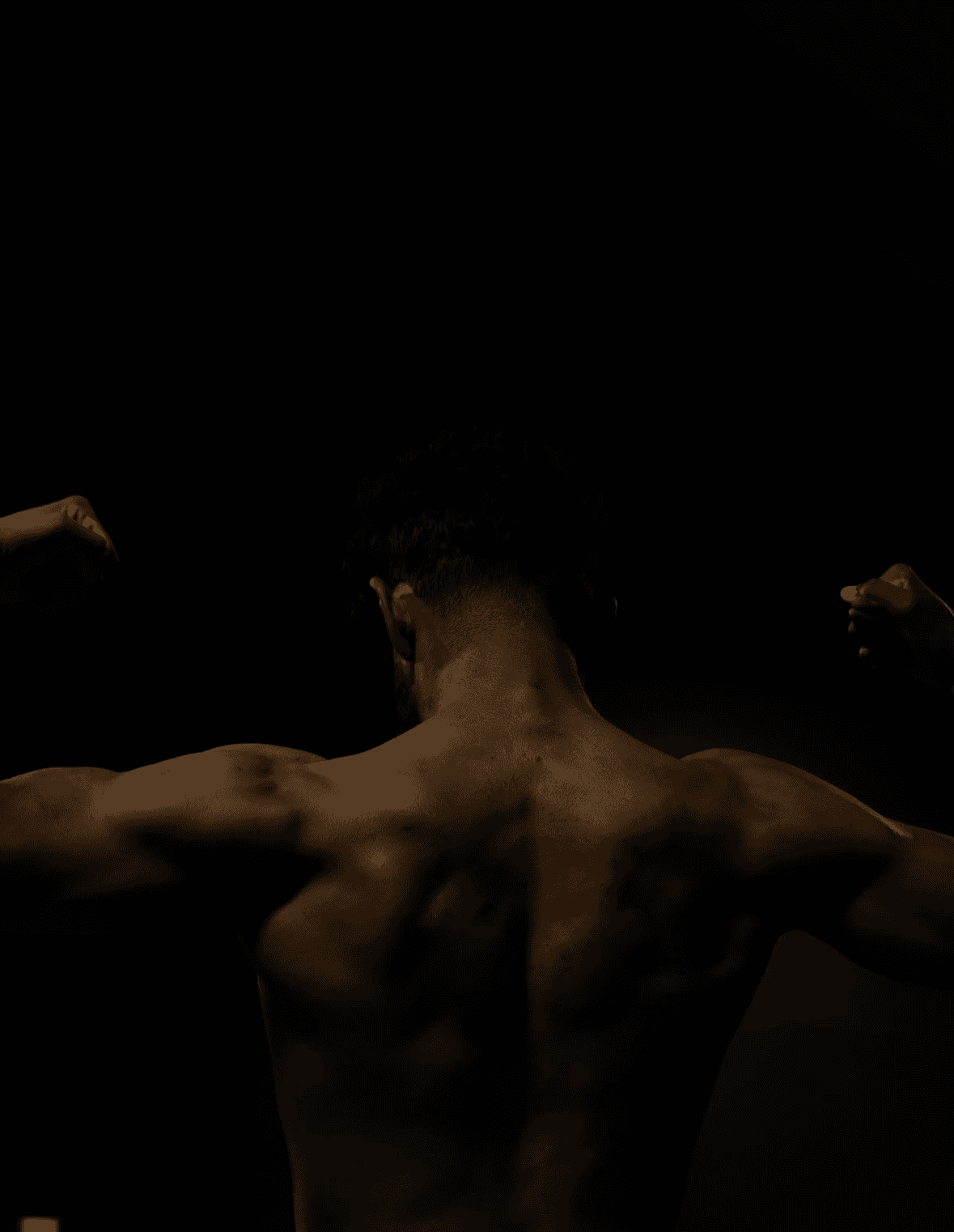 dramatic shock of the back of a flexing athlete