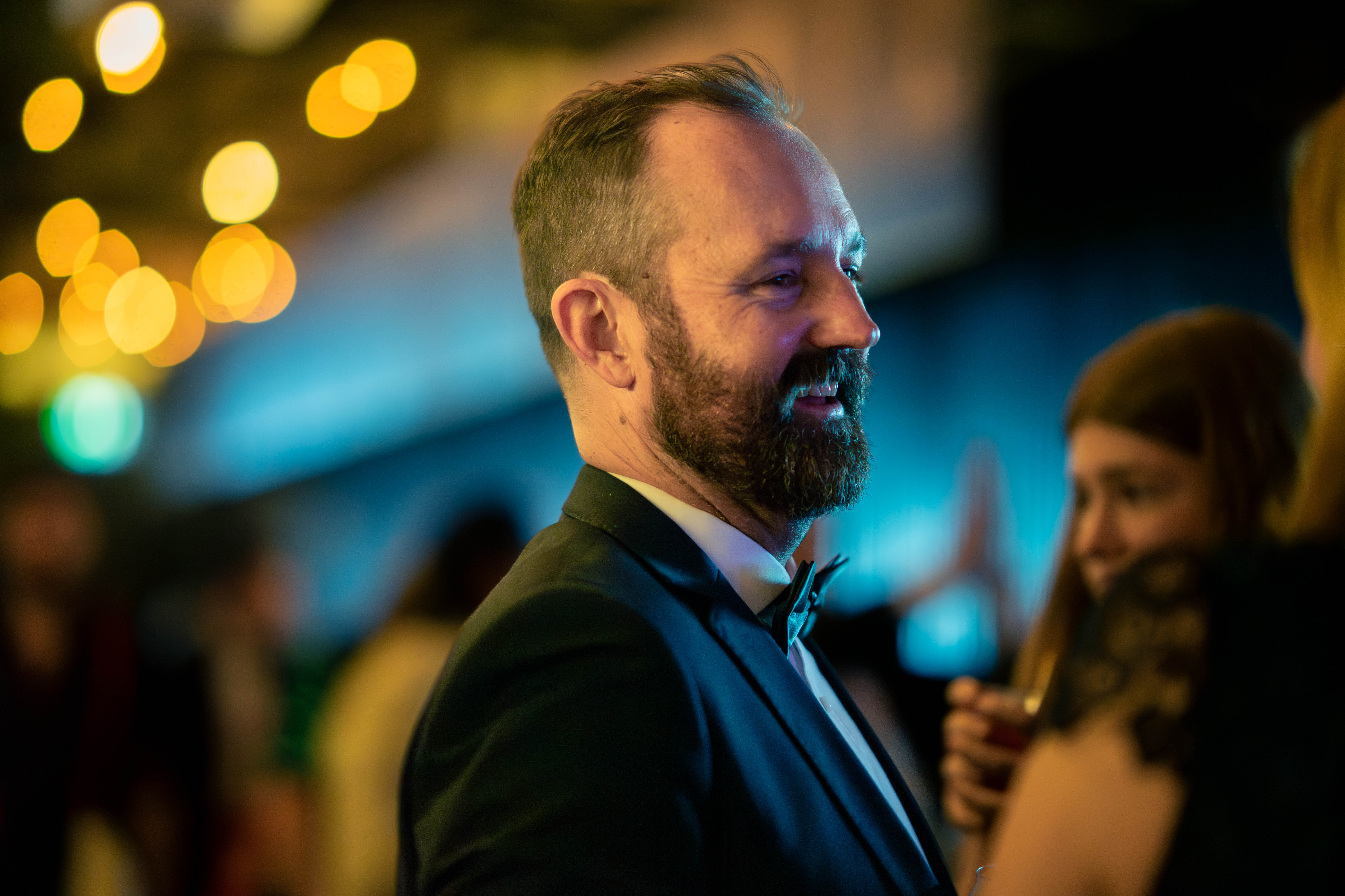 Sooky La La band member sitting on a green arm chair with lamp