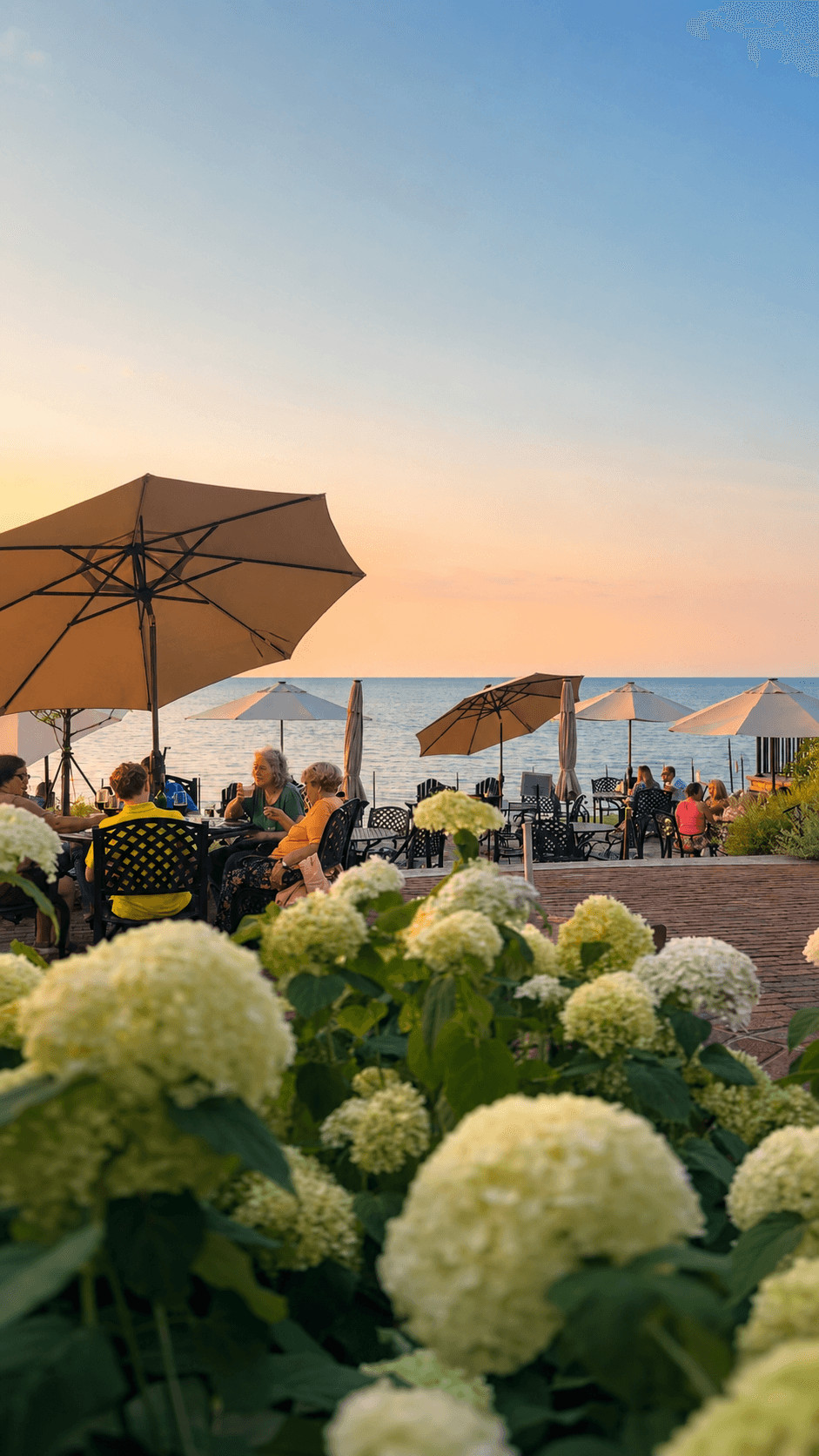 Guests dining on the Vincent William patio beside Lake Erie