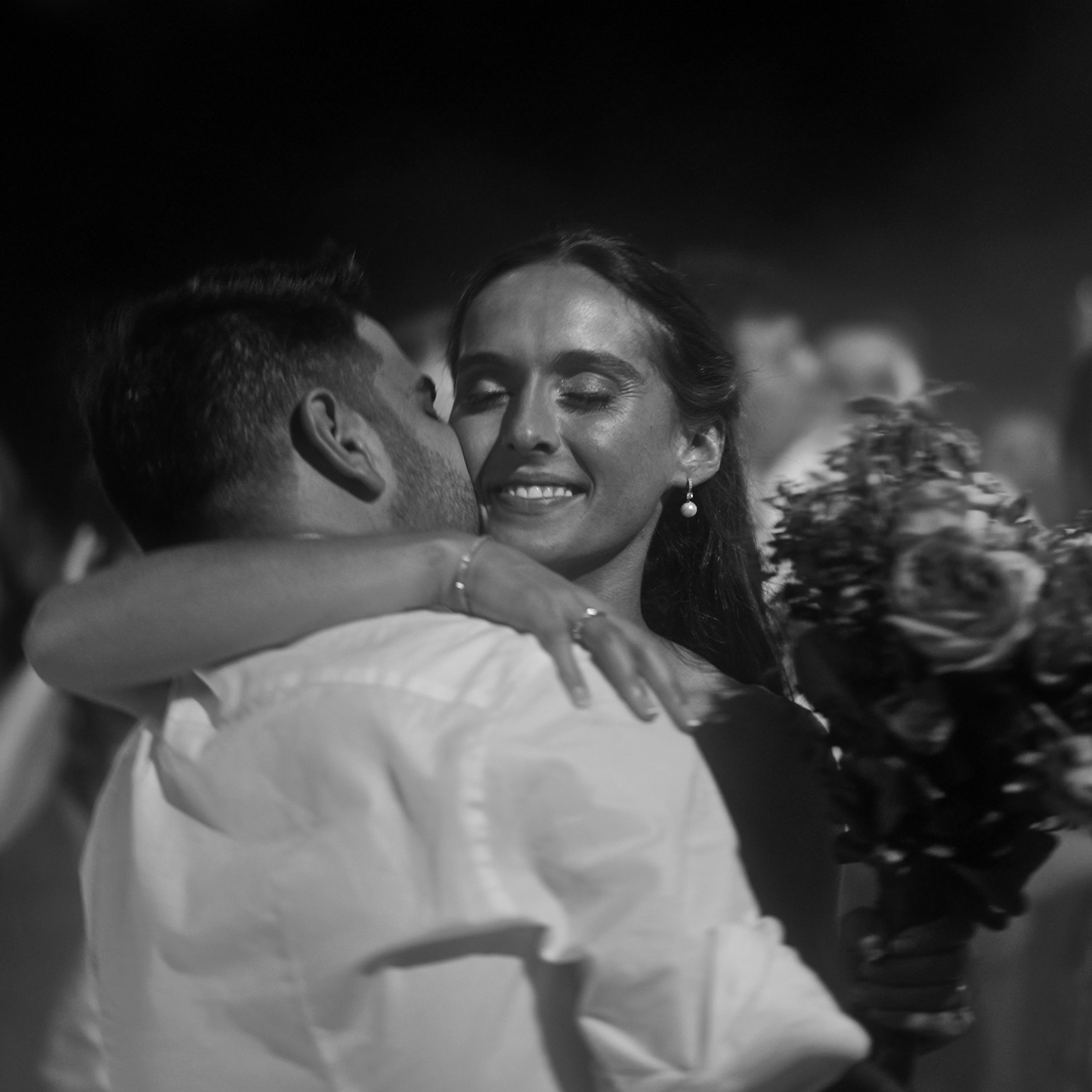 man holding gold ring on woman's finger