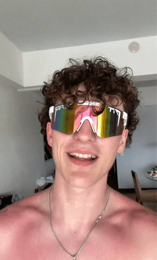 man standing beside wall