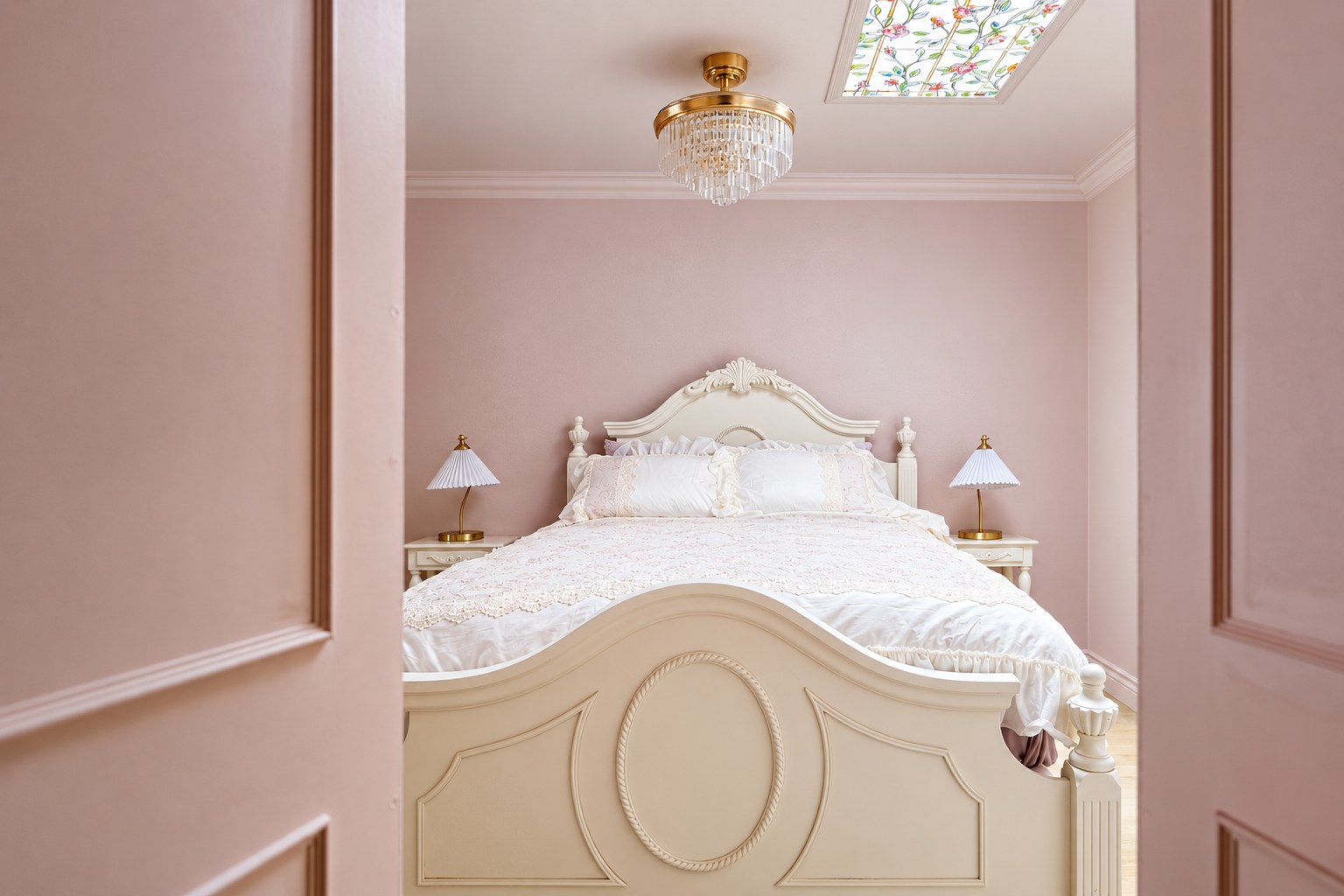 Pink and white bedroom with two queen beds, luxury bedding, and ornate furnishings