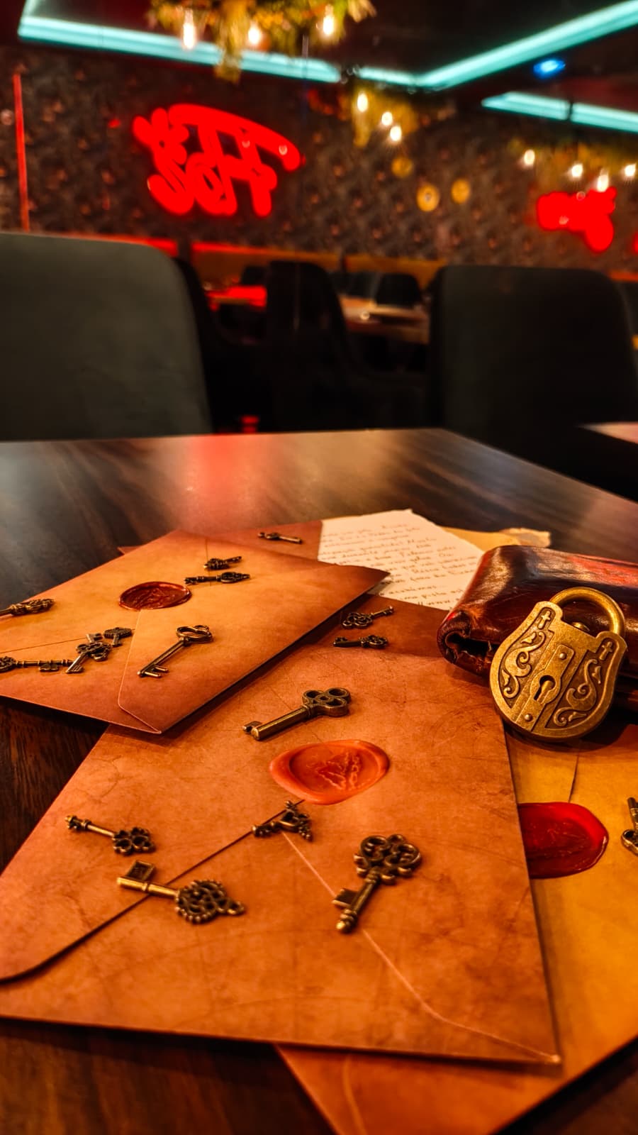 A wooden essential oil diffuser releasing a gentle stream of steam, surrounded by dried herbs and a small bottle of essential oil. The warm lighting enhances the cozy and therapeutic ambiance.