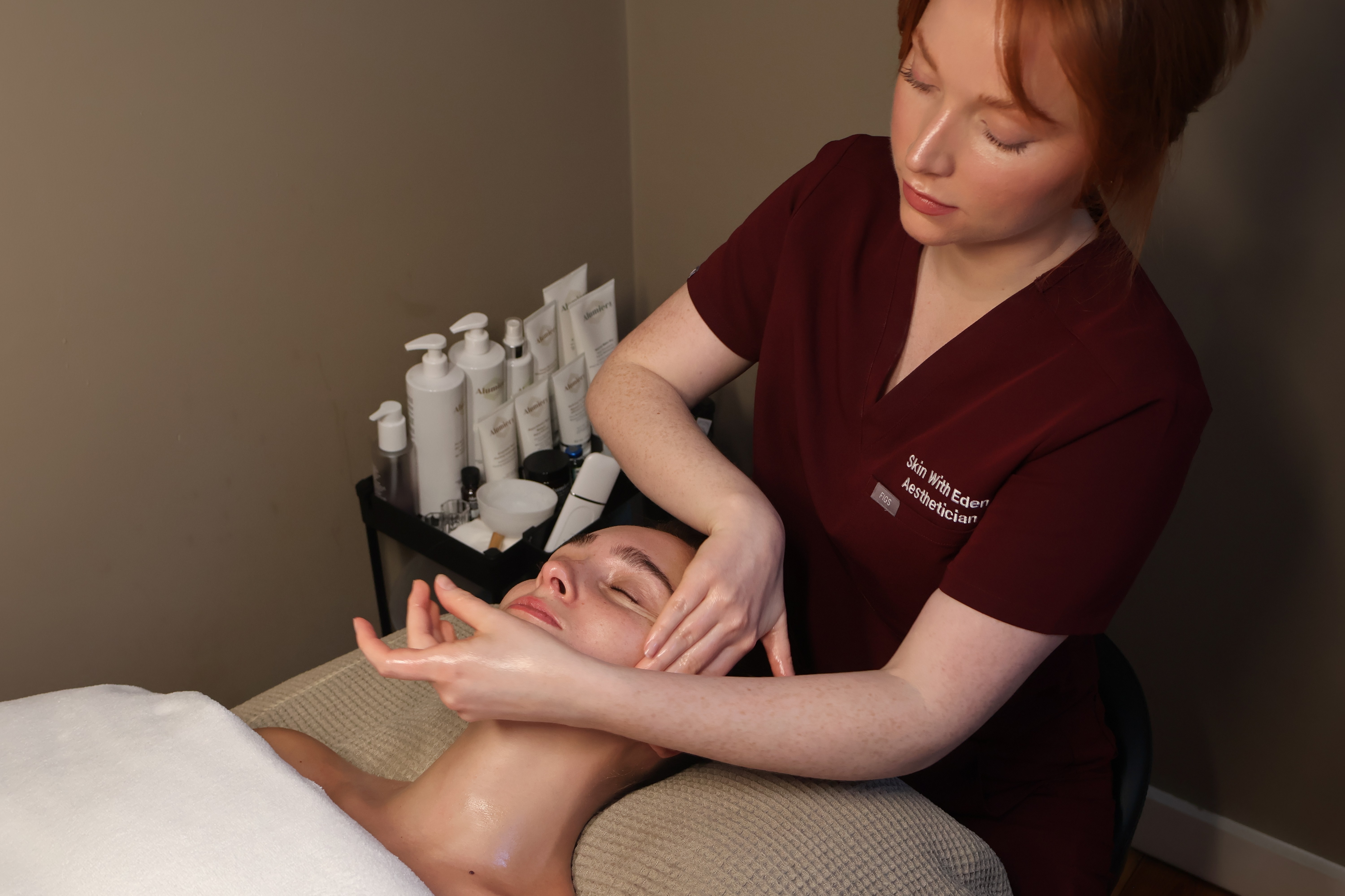 Rachel, personal trainer, looking to the side confidently in a fitness studio