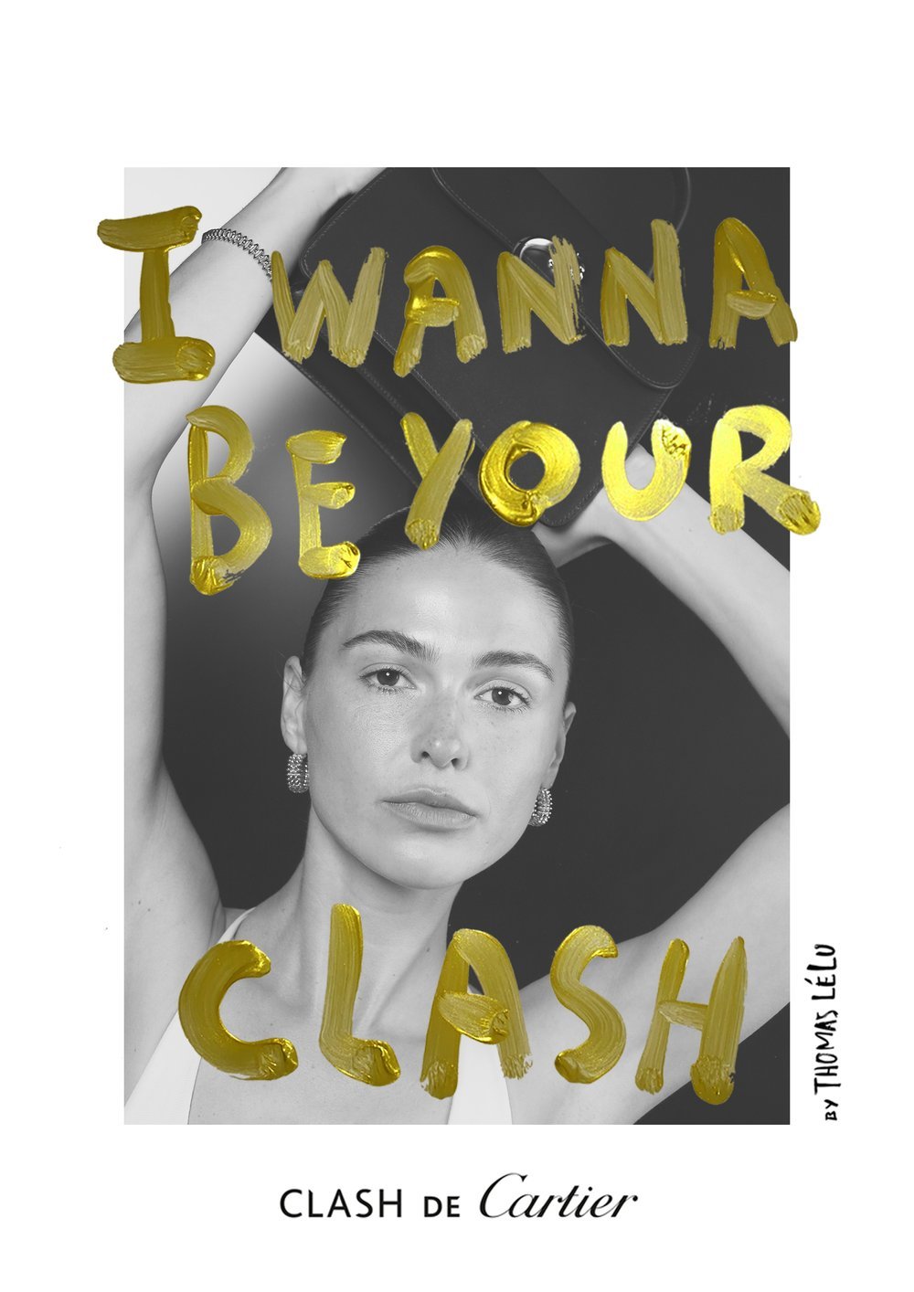 Black-and-white portrait of a woman with short hair, wearing earrings, with gold painted text overlay that reads "I WANNA BE YOUR CLASH!" and a small label at the bottom that says "CLASH de Cartier".