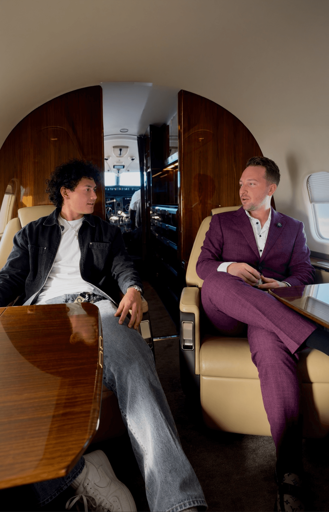 Ayden Parks and Michael Lanctot seated together in a private jet