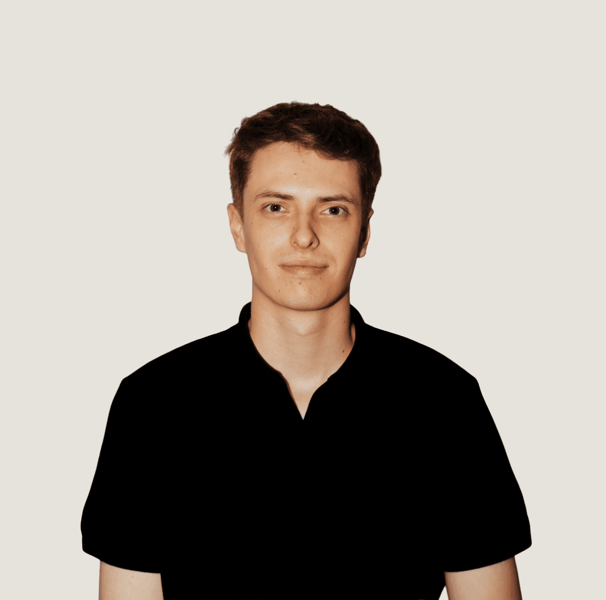 Portrait of a person in dark clothing speaking on a phone