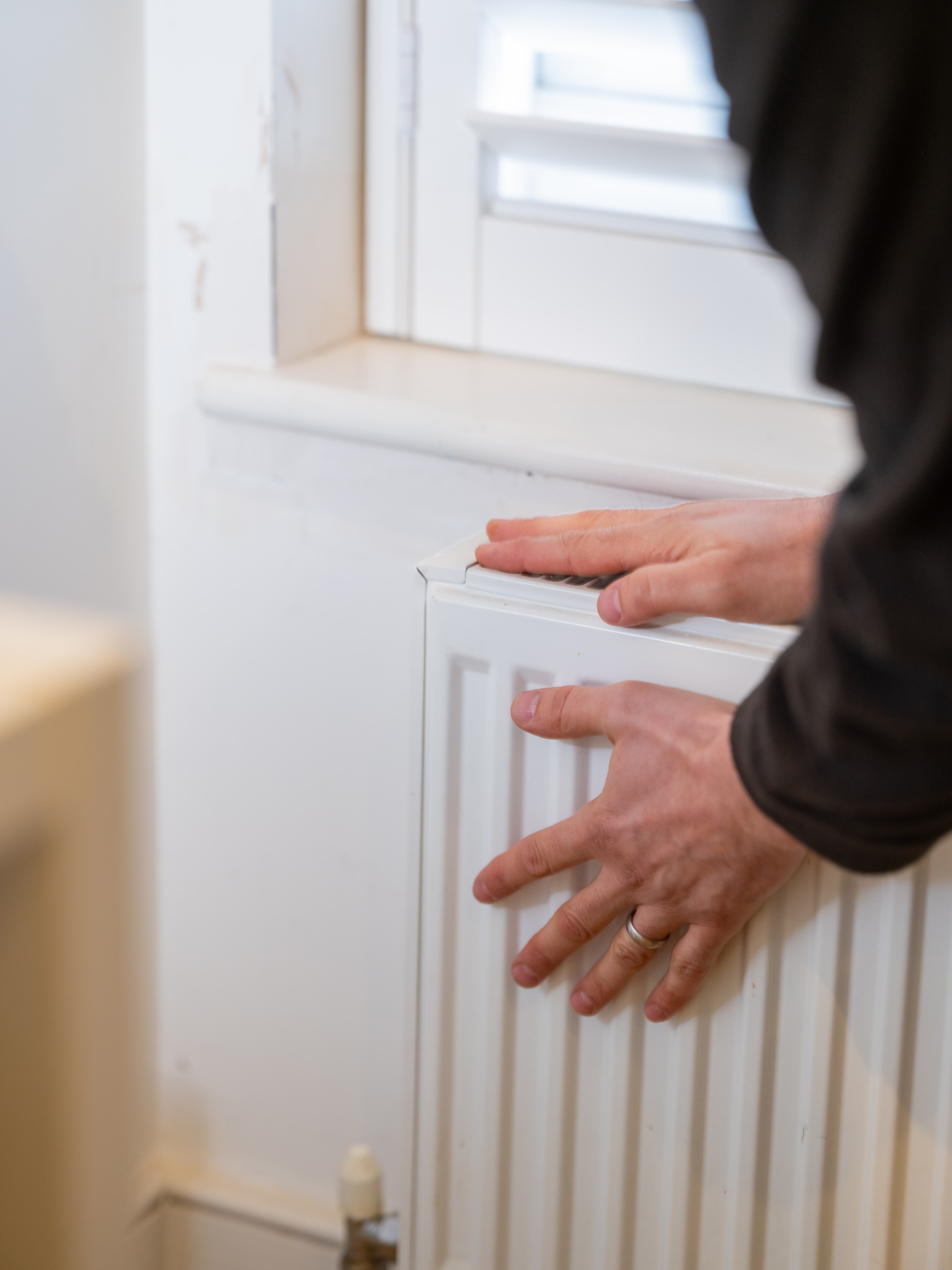 Plumber in north london carrying out central heating repair