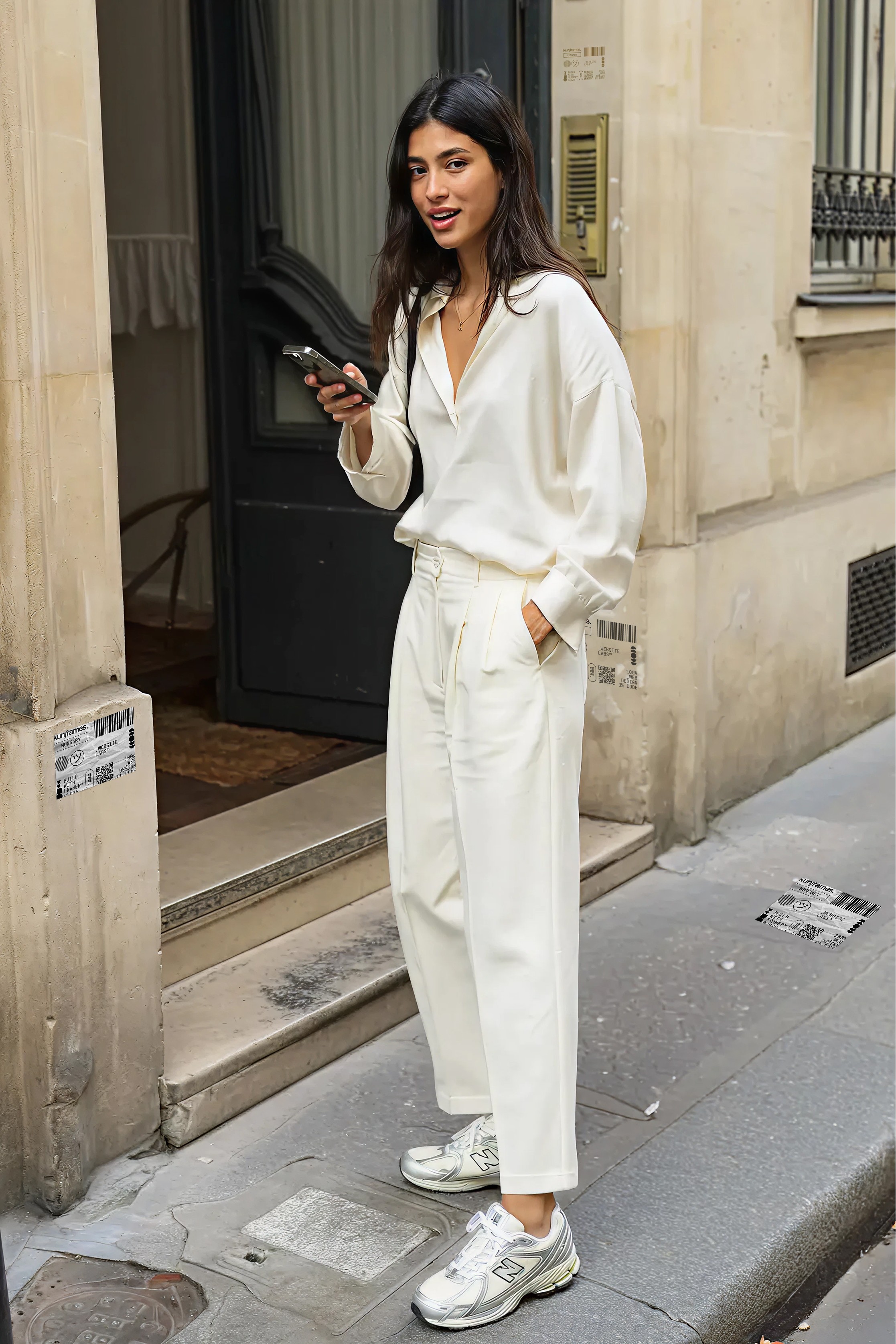 A beautiful and elegant young woman standing on the street