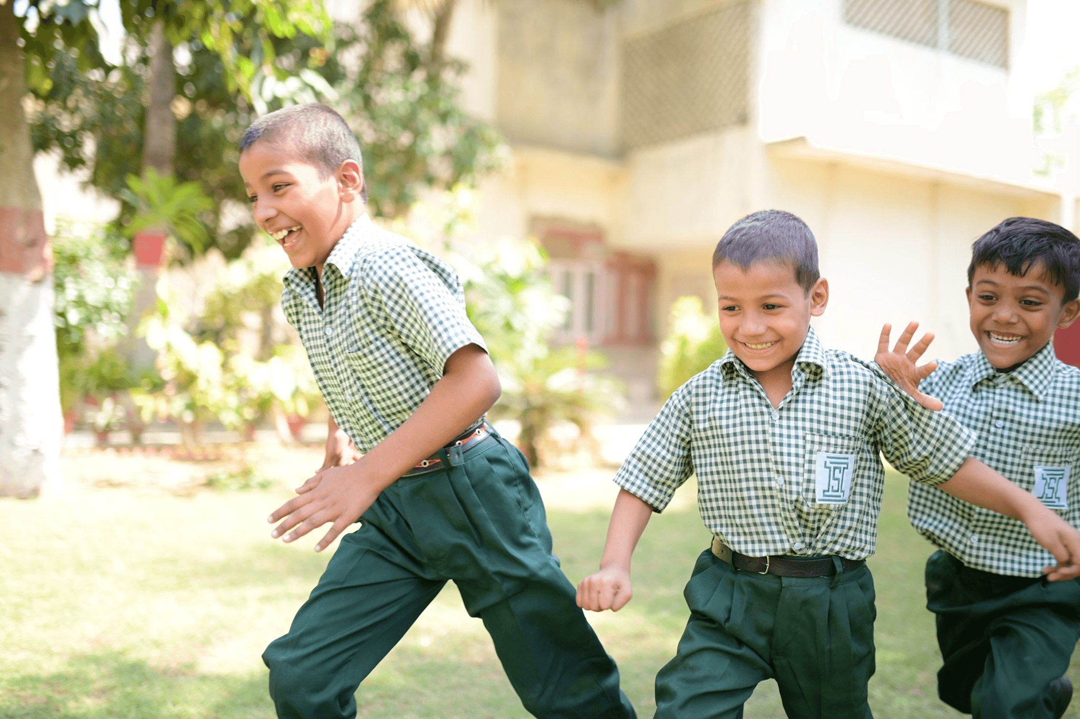 A mother and her daughter are working together on a laptop, focusing on homework