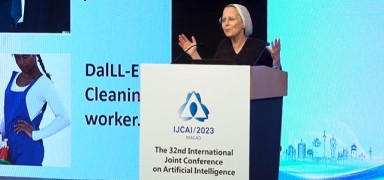 A speaker delivering a presentation at the conference.