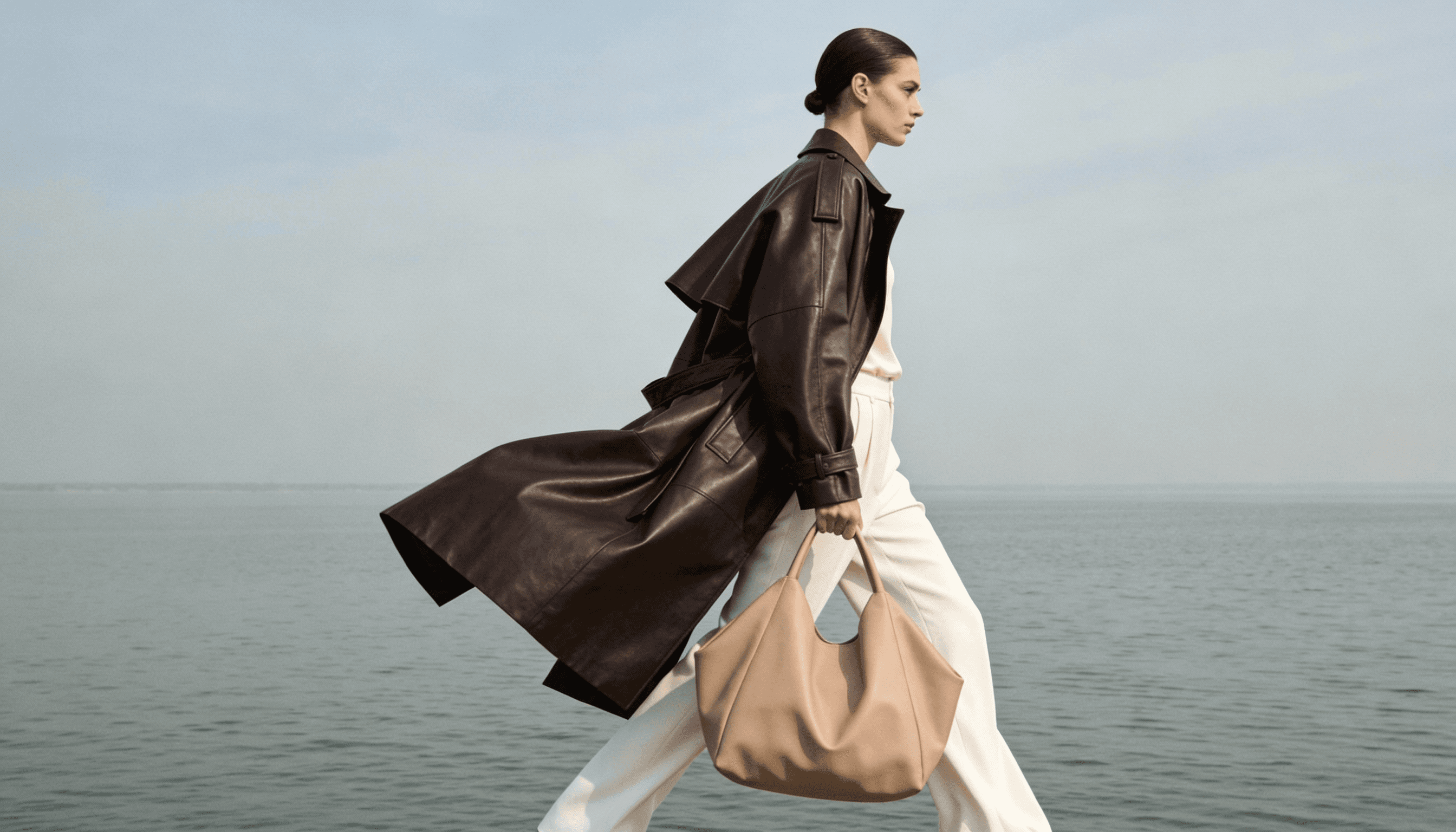 Futuristic sneaker with silver and green details, slightly blurred on an orange background