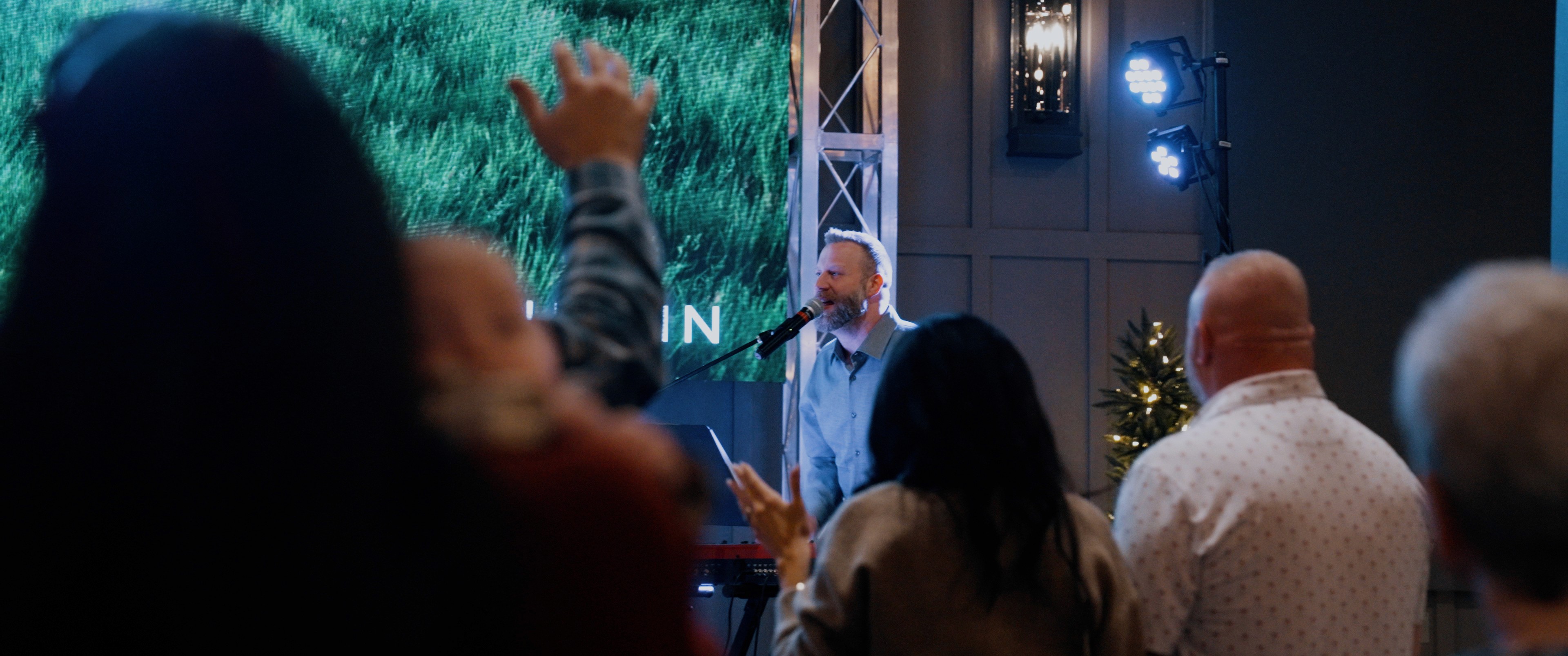 White building with red lighthouse under clear sky.