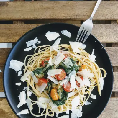 pasta dish on black ceramic plate