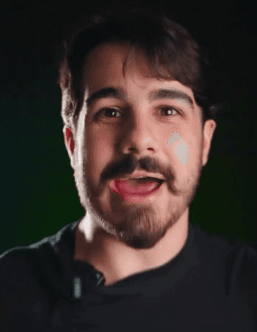 A person in a blue coat smiling