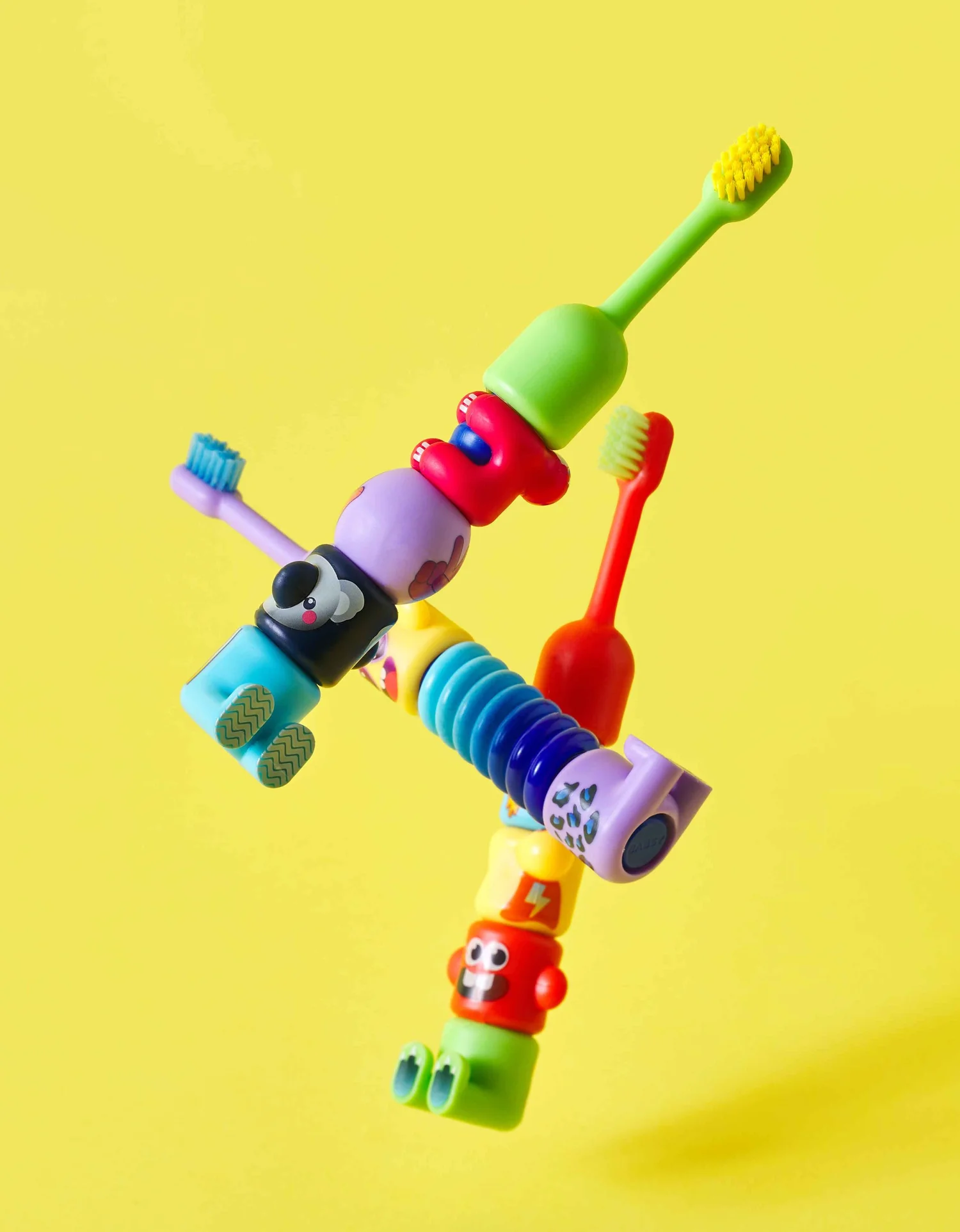 Colorful Babsy Build-A-Brush children's toothbrush with interchangeable character pieces