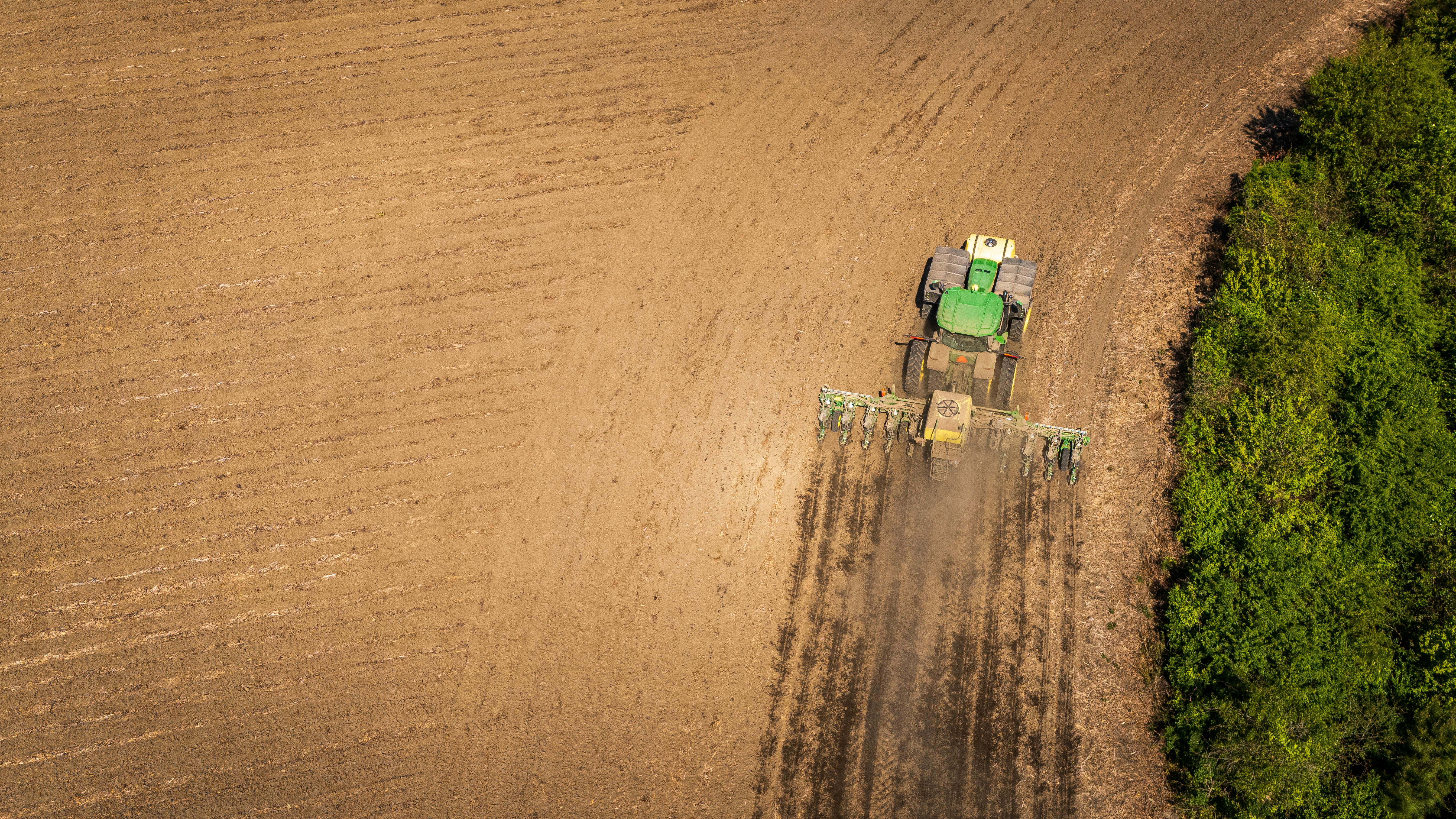 A tractor plowing a field