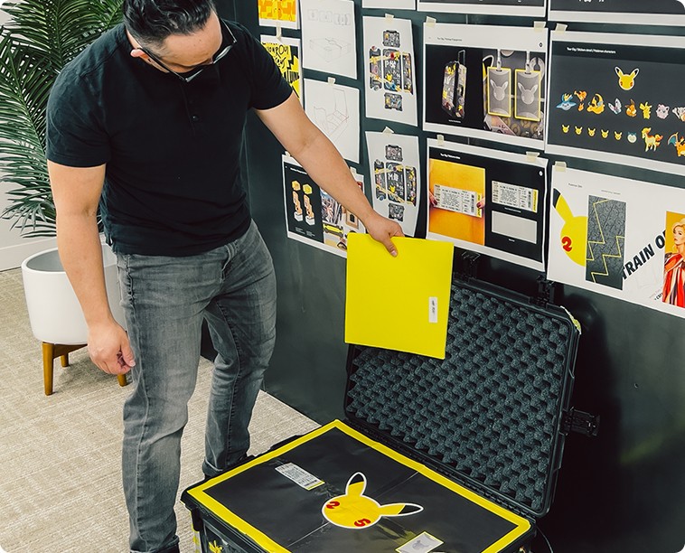 A Ten Gun employee examining an assembled influencer kit