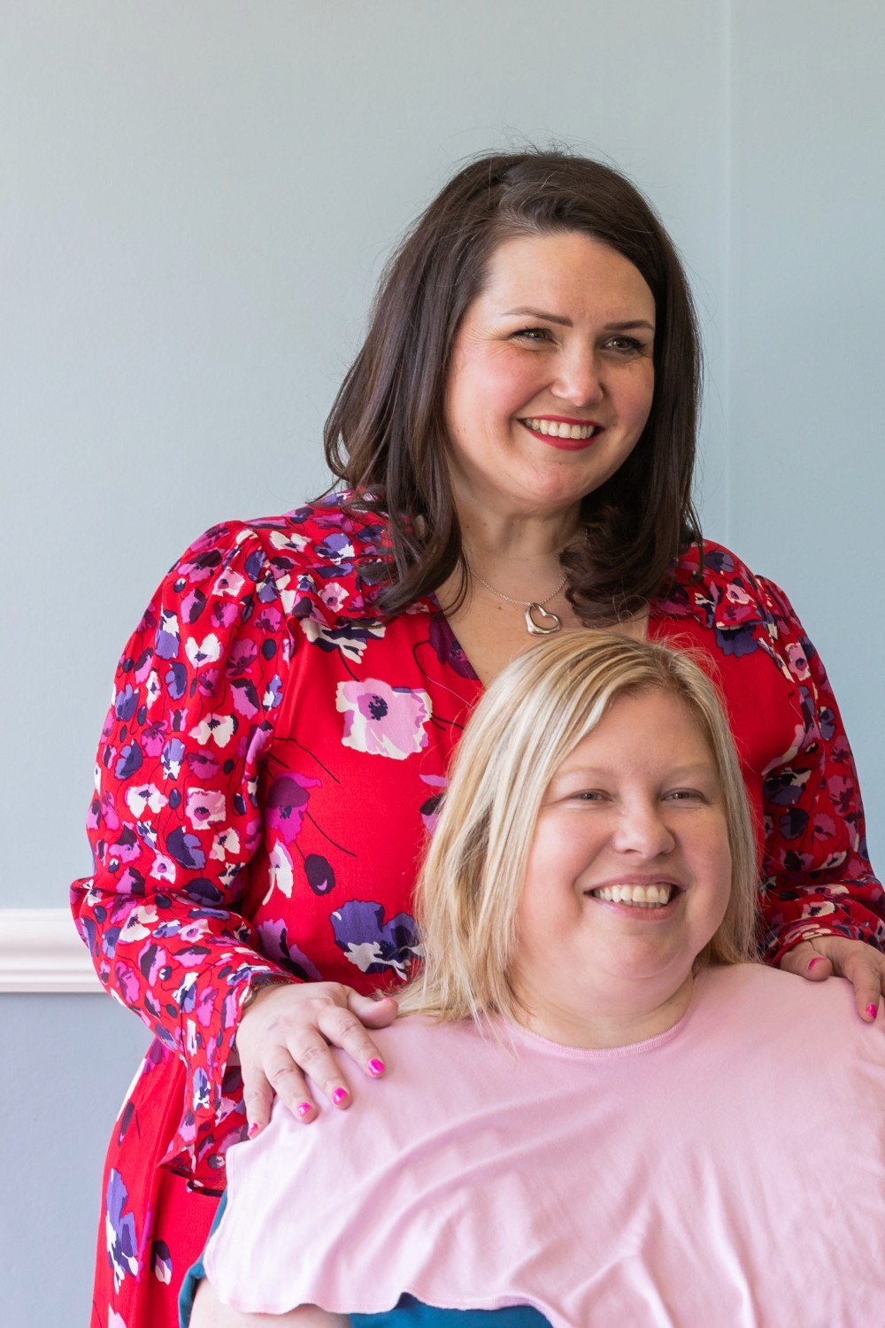 Lucy doing colour analysis on smiling client.