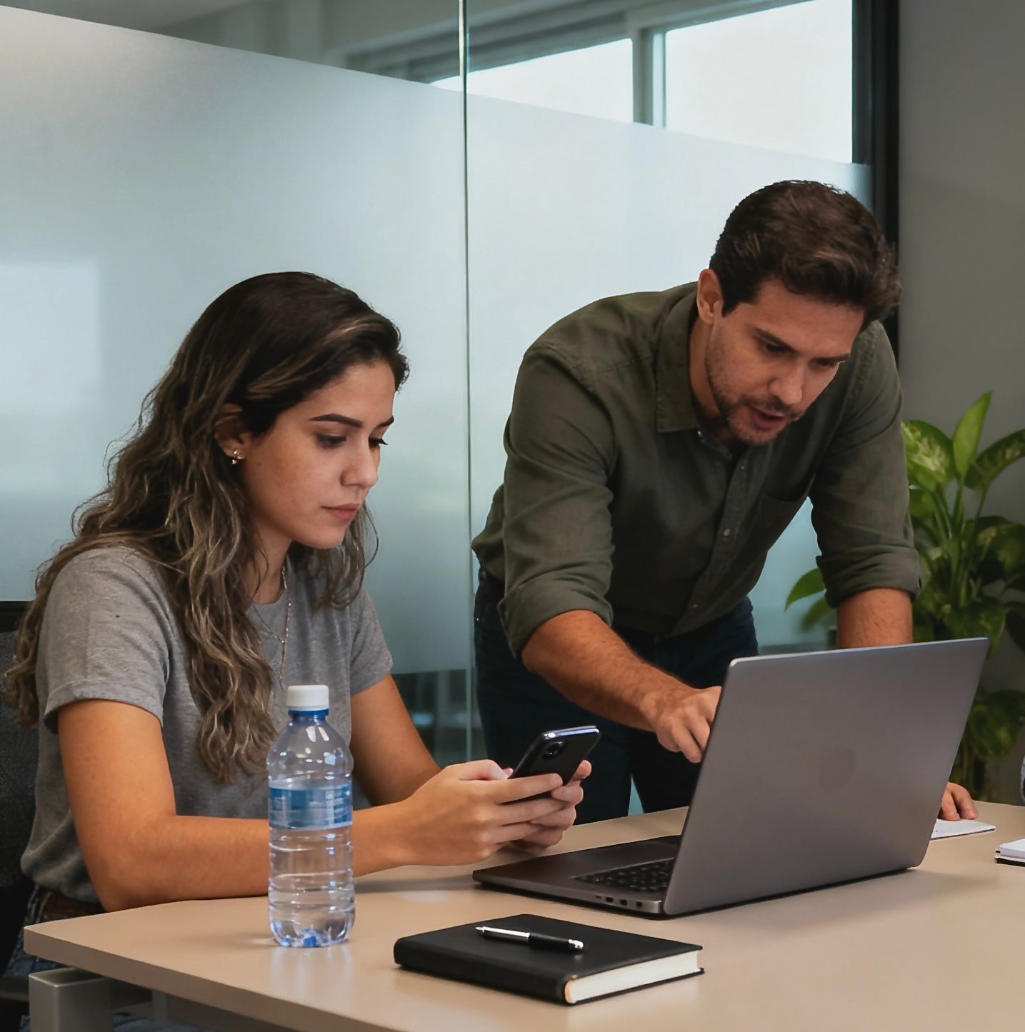Woman drinking a dark beer in a brewery