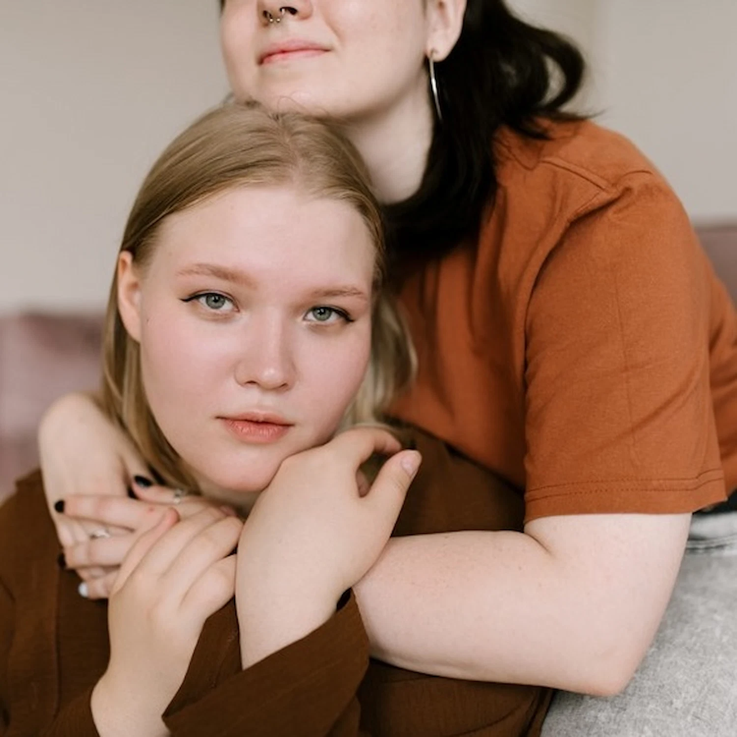 Couple sharing an intimate and supportive embrace, symbolizing trust and connection in lesbian affirming therapy in Los Angeles.