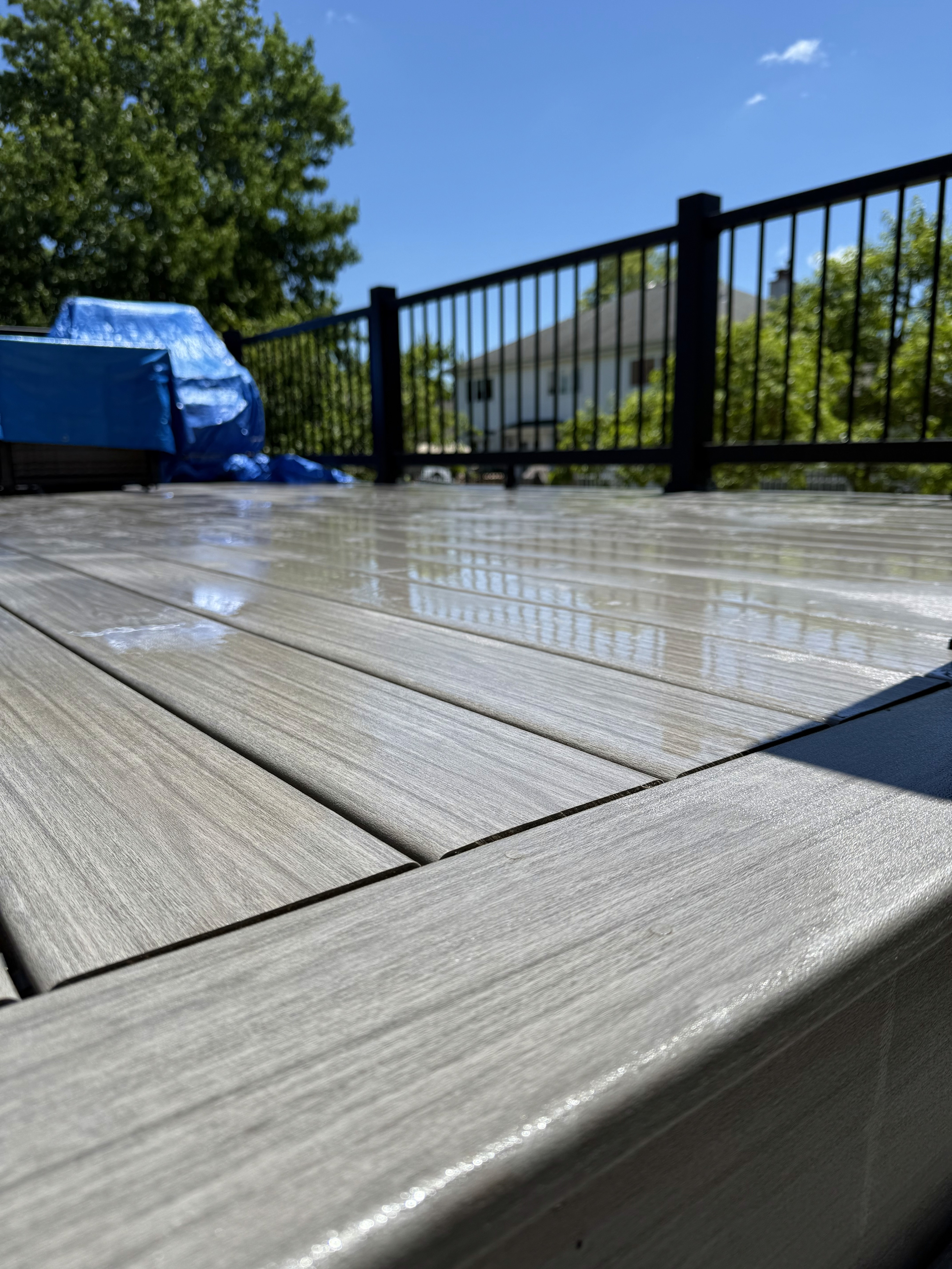 Composite deck detail beside a second-story home addition