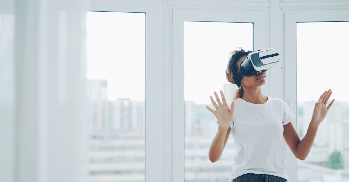 A woman enjoying a virtual reality experience with VR headset indoors.