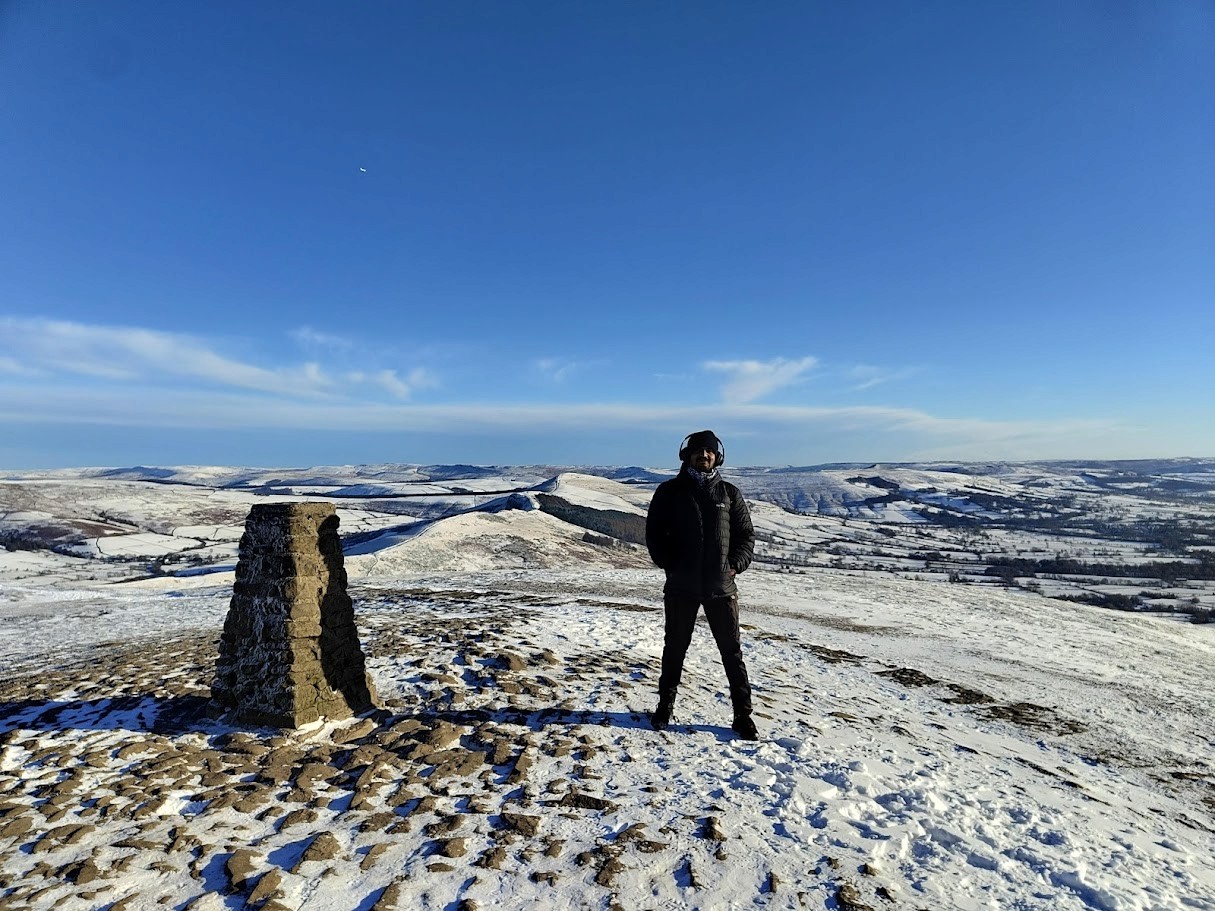 man filming on beach