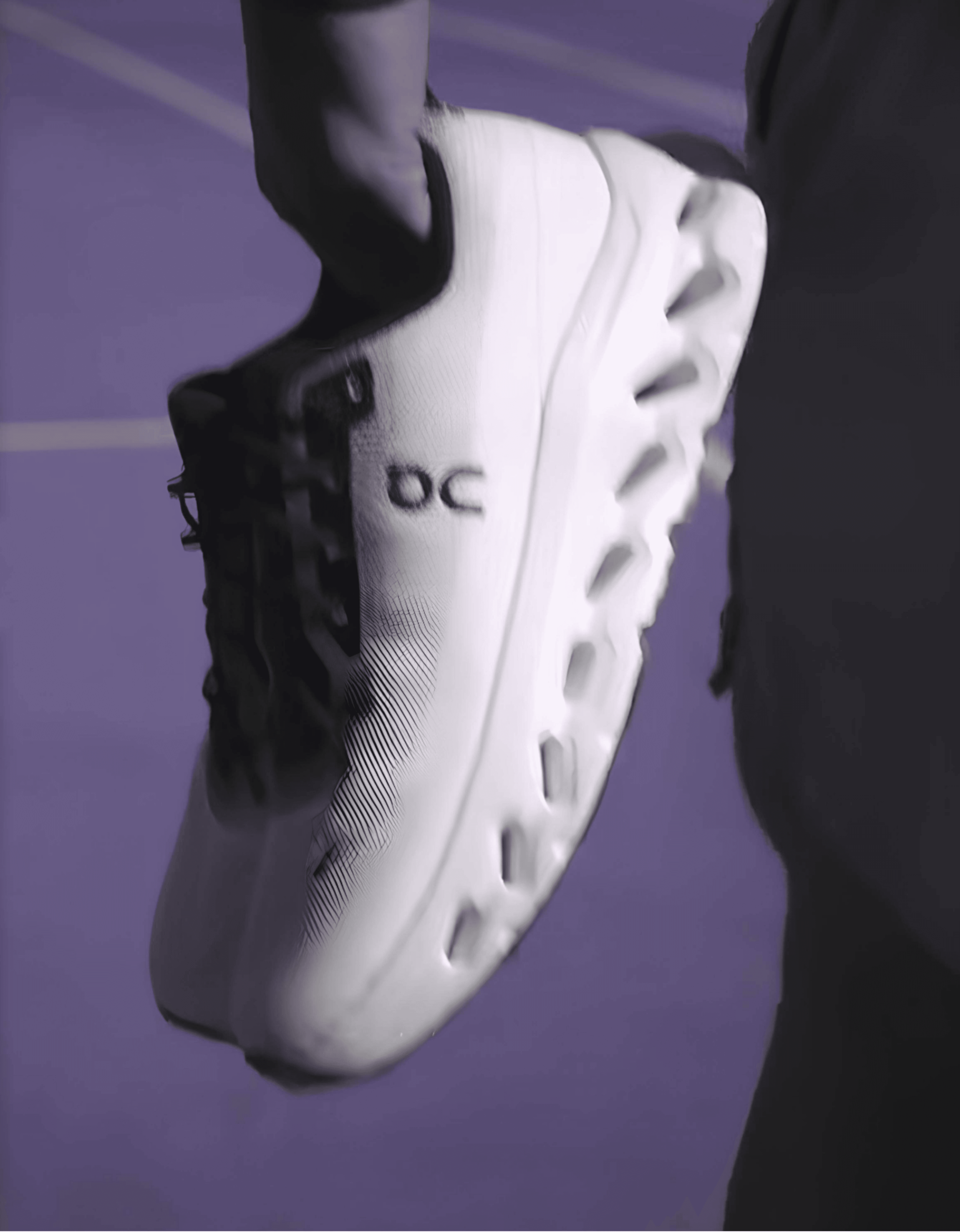 Close up shot of athlete holding On shoe