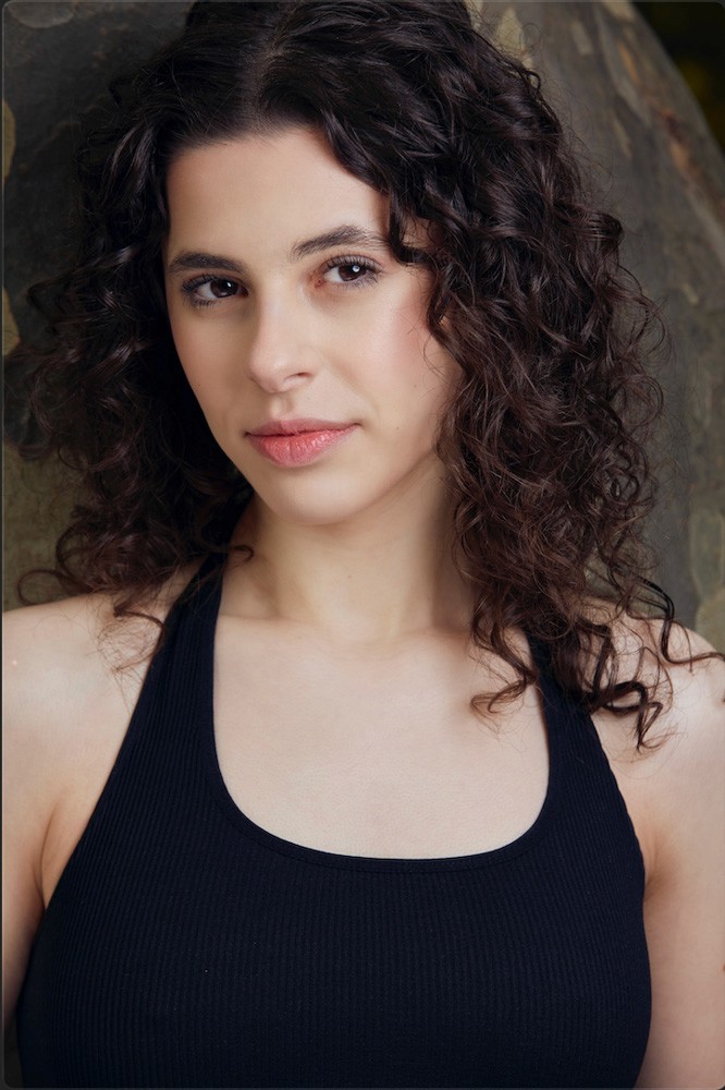 portrait of Laura Nayman, curly hair, brown eyes