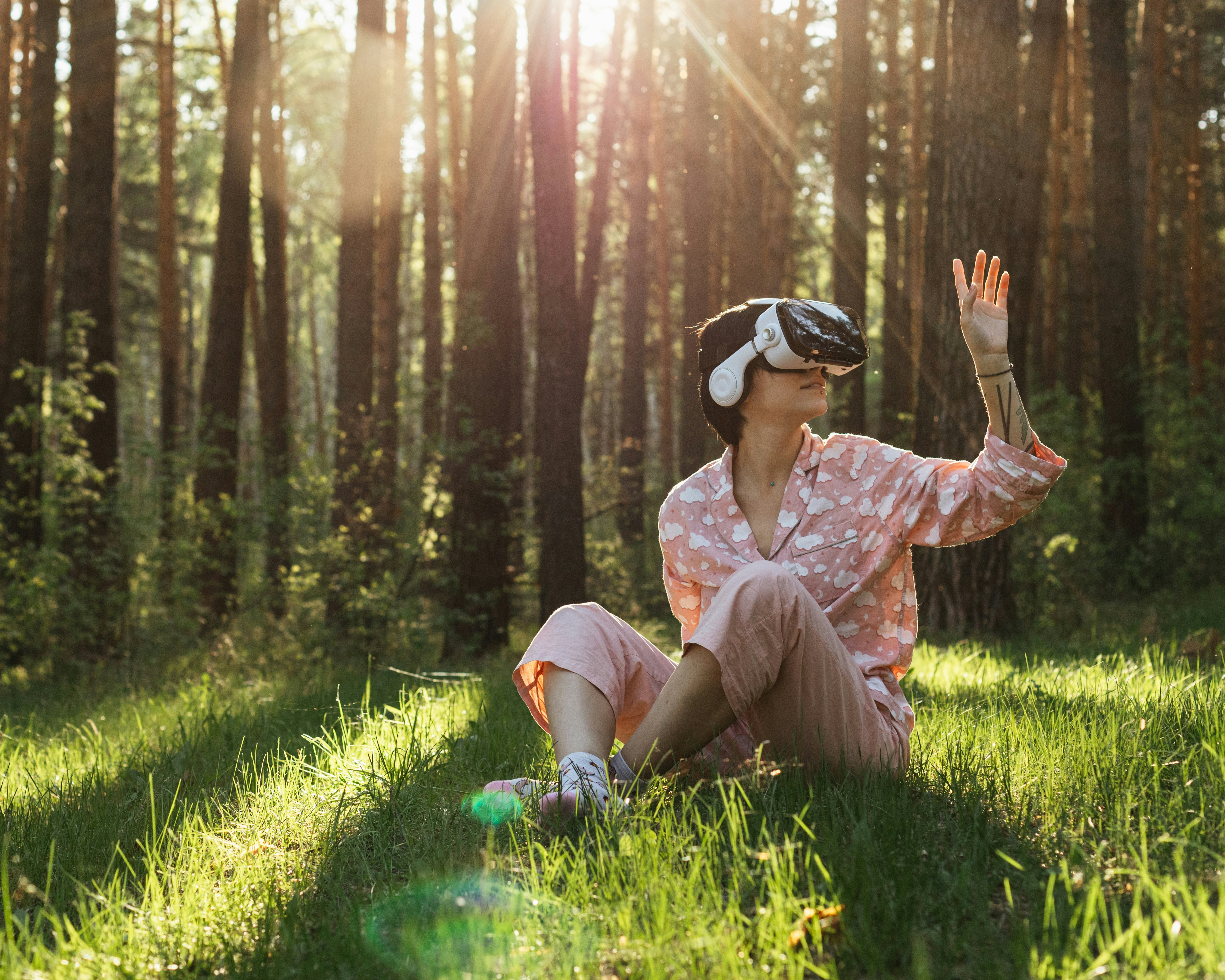 Woman wearing a VR headset at home, exploring new technology through Oxigen’s flexible rental service that lets users try devices before buying