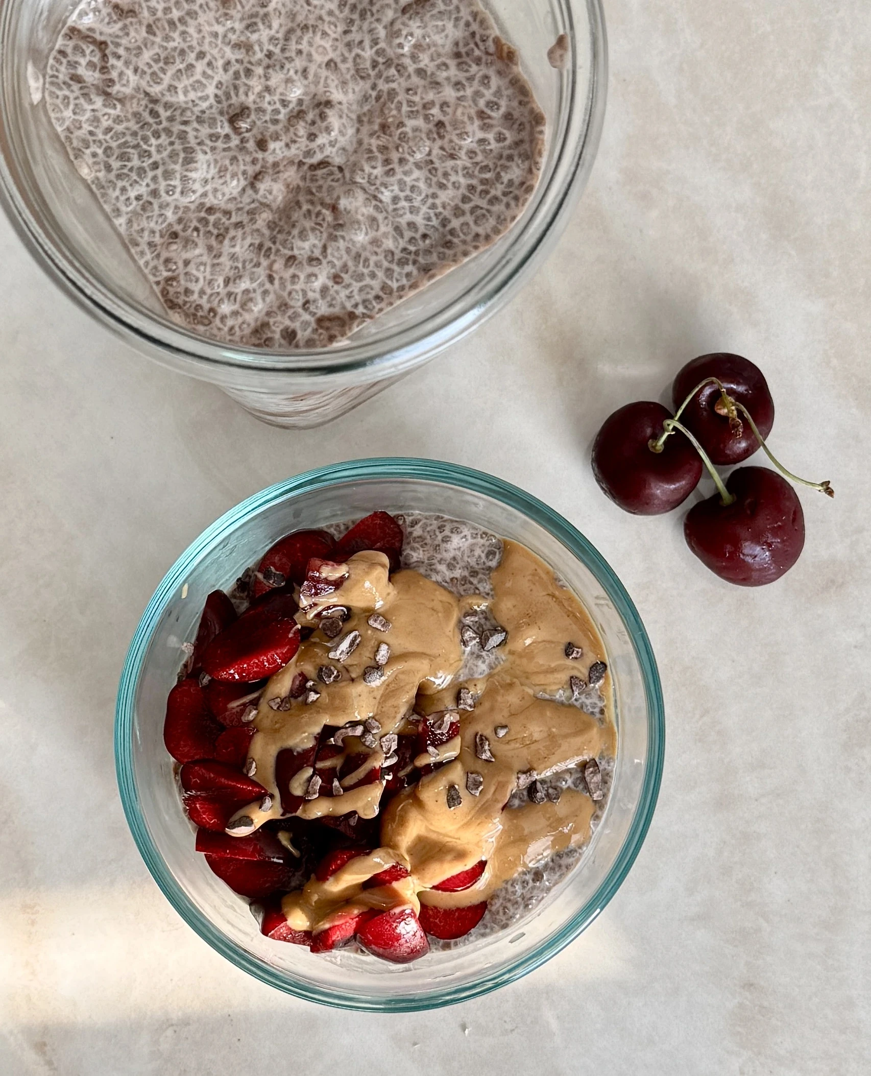a prepped container with chocolate peanut butter chia pudding that is high-protein, gluten-free, and dairy-free