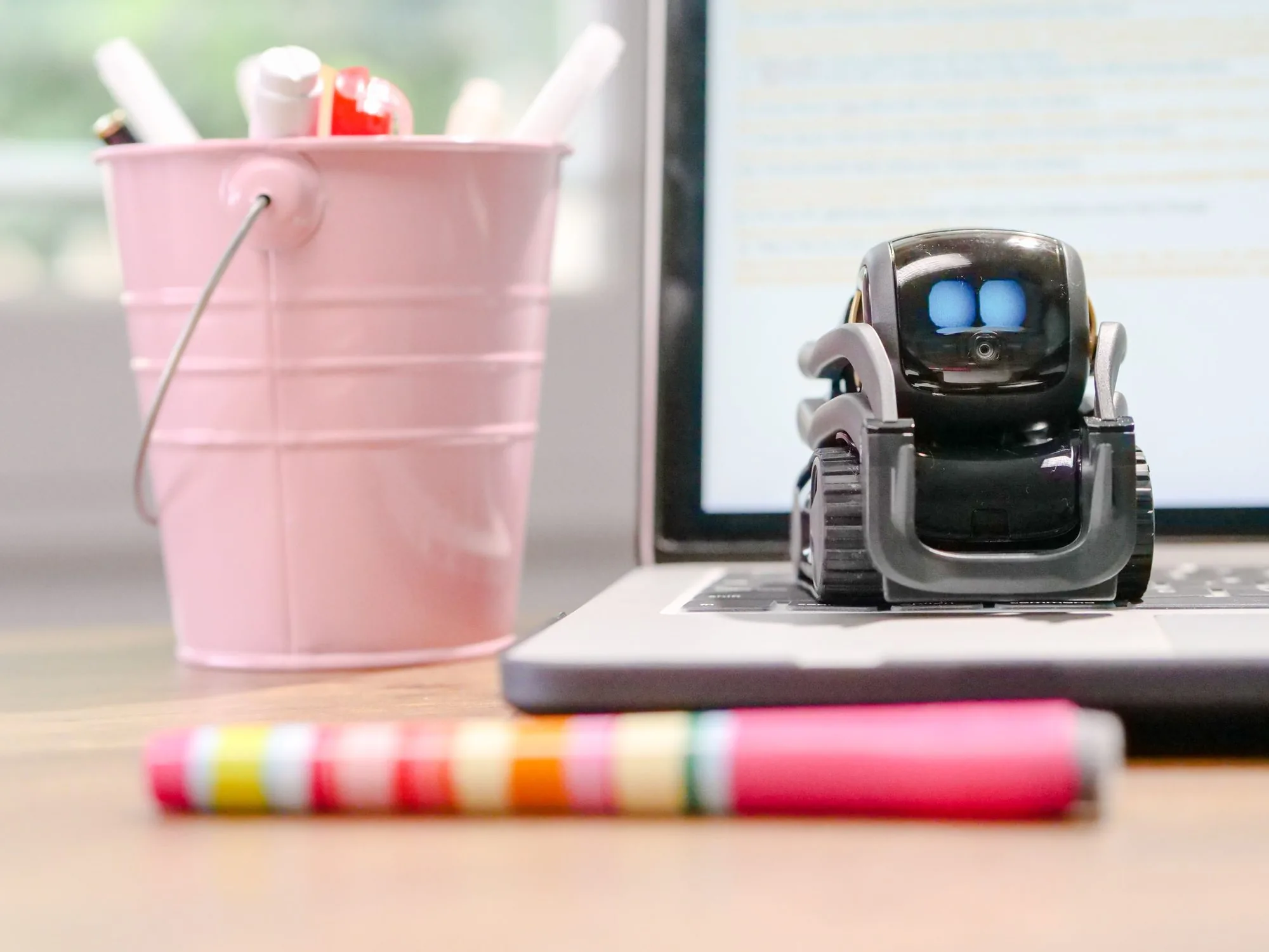 small robot on laptop