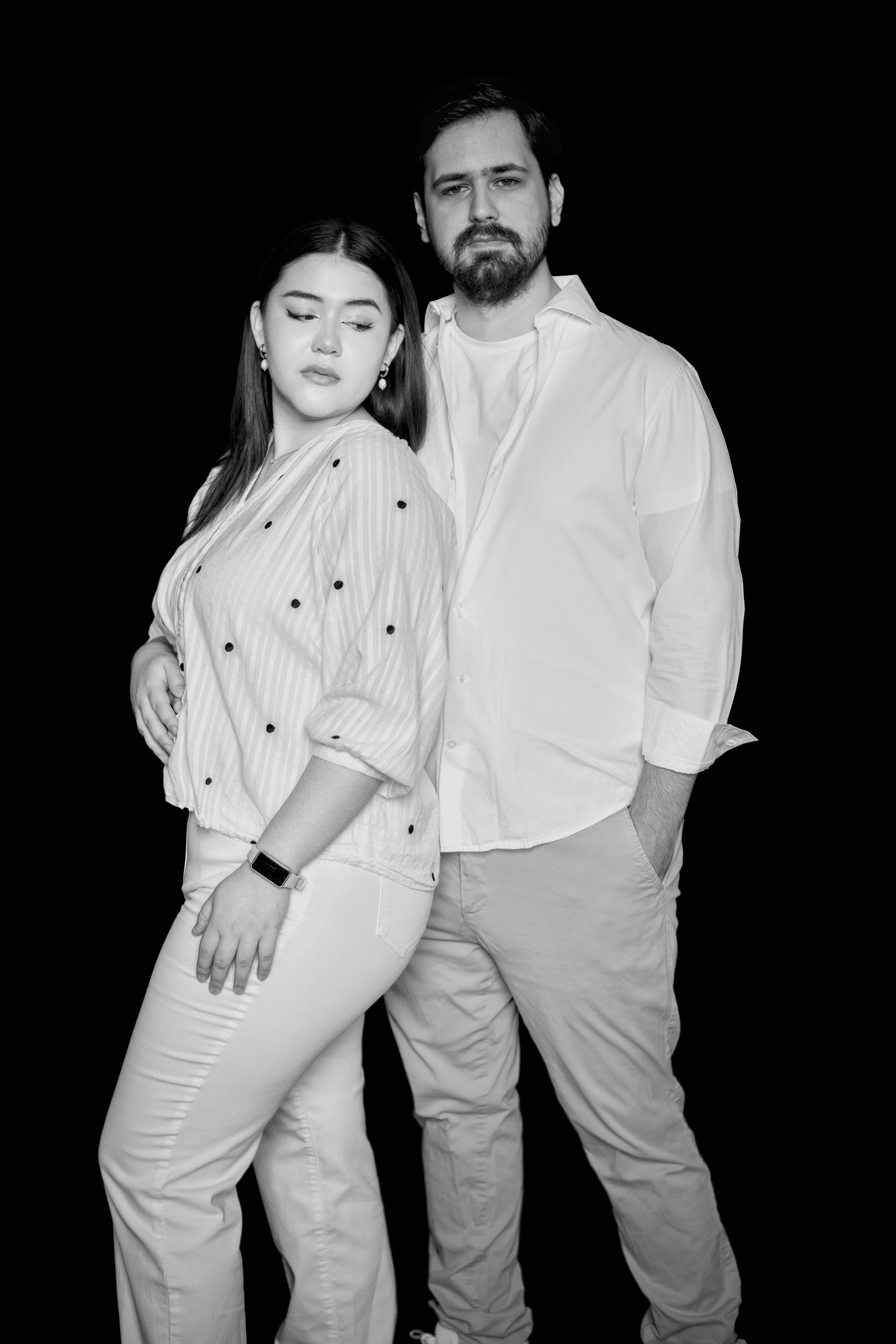 Person stand in front of a red sports oldtimer