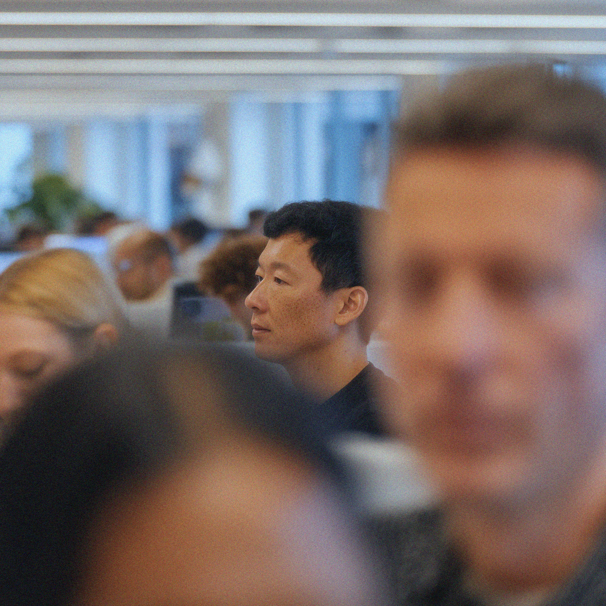 People celebrating, red stickers floating in the air