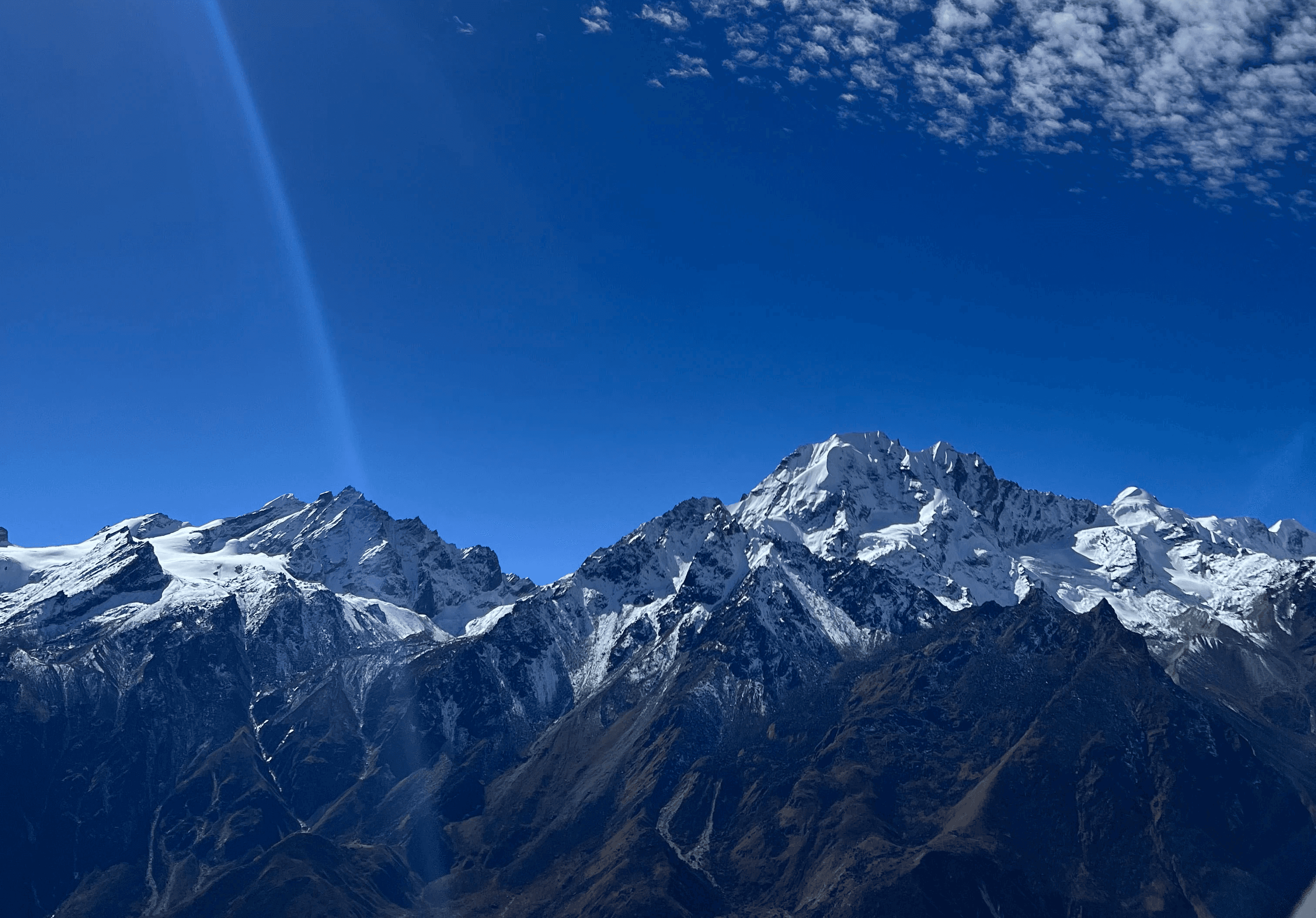 a group of people walking on a sidewalk